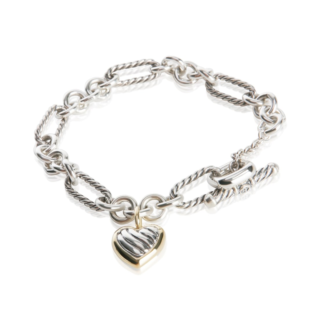 David Yurman Figaro Heart Charm Bracelet 18k Gold Sterling Silver: David Yurman Figaro Heart Charm Bracelet 18k Gold Sterling Silver Pre-owned David Yurman Figaro Heart Charm bracelet crafted in yellow gold and sterling silver. This unisex bracelet features a toggle 
