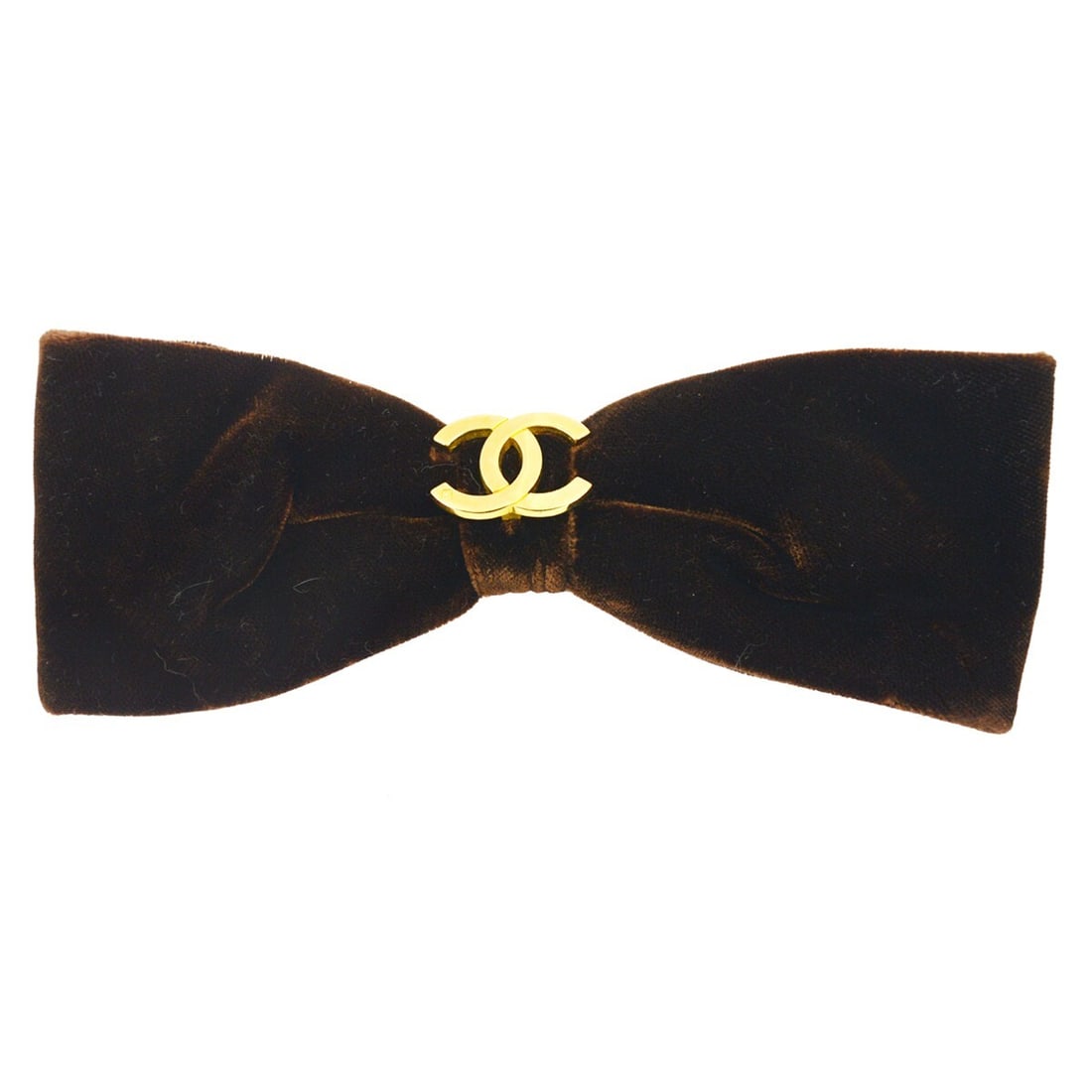 CHANEL bow velvet hair barrette in brown: CHANEL bow velvet hair barrette in brown Brown Chanel velvet hair barrette with a bow accent. Made in France, this women's accessory is designed for casual wear and is suitable for all hair types. The