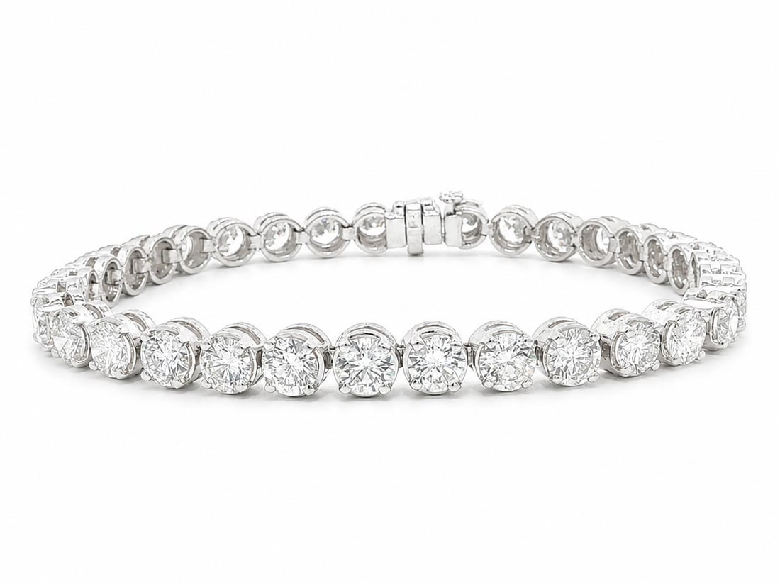 Platinum line tennis bracelet with 34 round brilliant diamonds 12ctw: Platinum line tennis bracelet with 34 round brilliant diamonds 12ctw Substantial women's line tennis bracelet crafted in solid platinum and set with 34 natural genuine round brilliant cut diamonds. Th