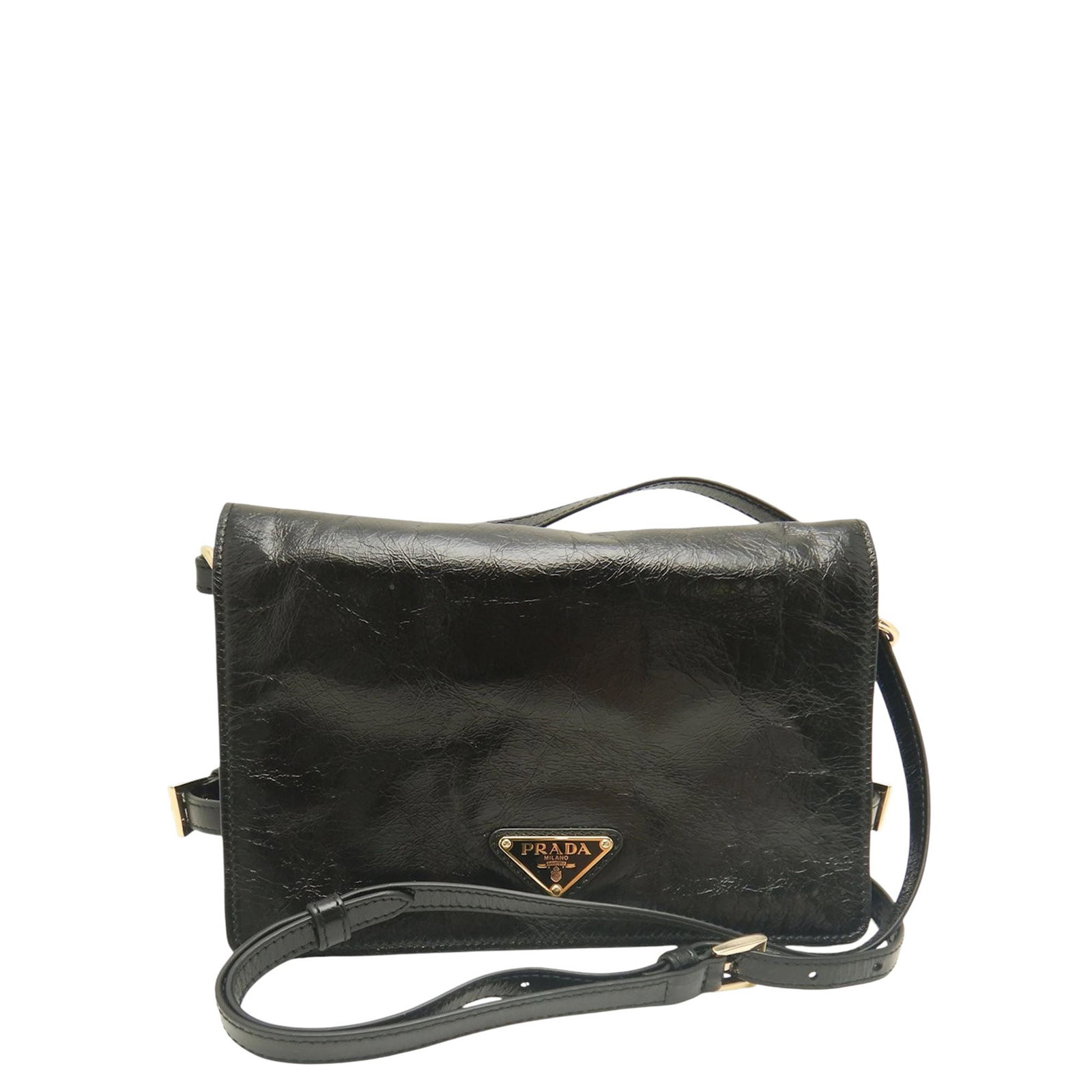 Prada Crinkled Calfskin Leather Crossbody Bag Black: Prada Crinkled Calfskin Leather Crossbody Bag Black Prada Crinkled Calfskin Crossbody bag in black leather, made in Italy. It features an adjustable flat leather strap, a front flap with side belt clo