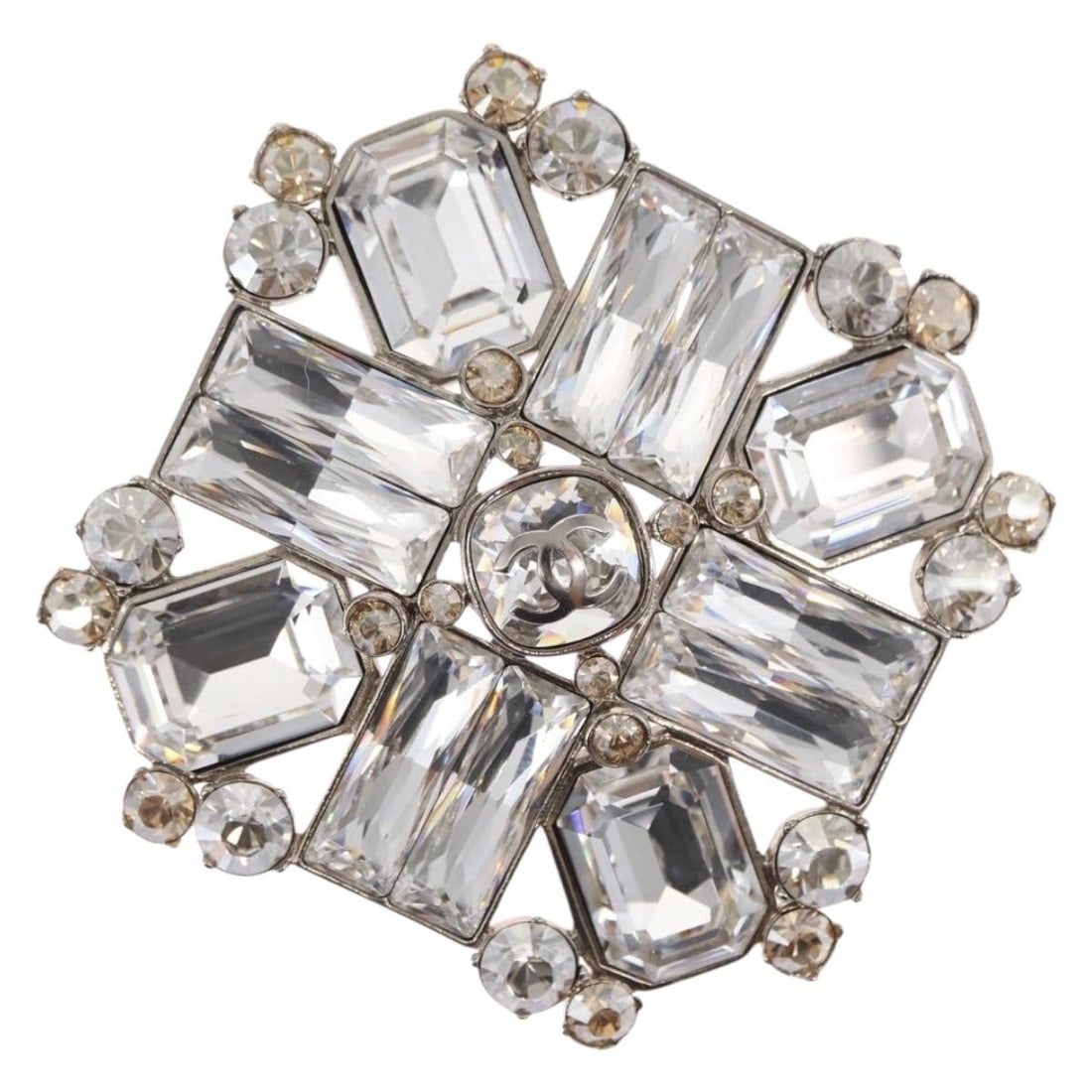 Chanel Silver Metal CC Logo Brooch with Rhinestone Detailing and Box: Chanel Silver Metal CC Logo Brooch with Rhinestone Detailing and Box This CHANEL brooch features the iconic CC logo design, crafted from silver-toned metal and adorned with rhinestones. Made in France
