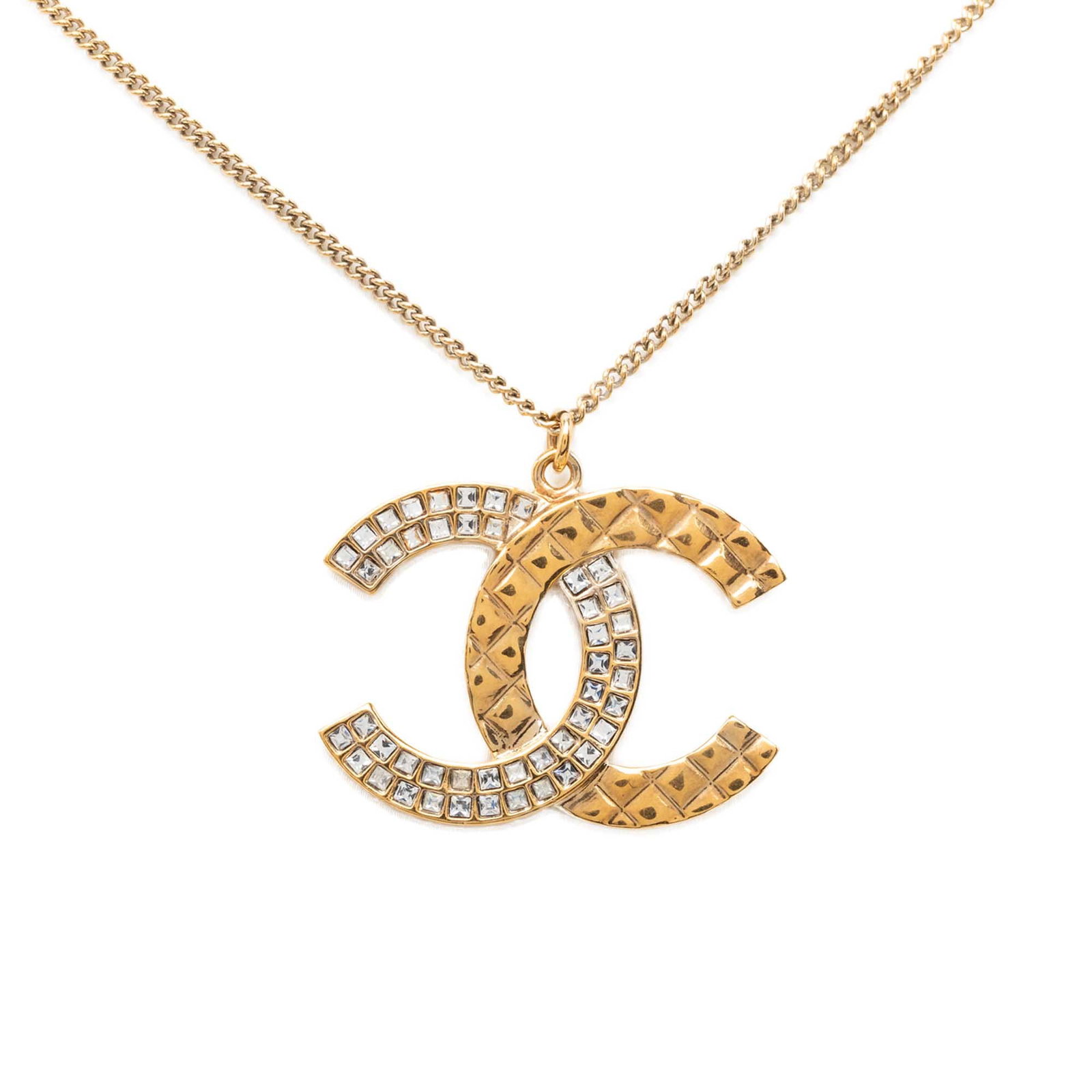 Chanel CC Quilted Pendant Necklace Gold Tone Metal with Rhinestones: Chanel CC Quilted Pendant Necklace Gold Tone Metal with Rhinestones Chanel CC quilted pendant necklace with a gold tone metal body, rhinestone embellishments, and a lobster clasp closure. Made in Ital