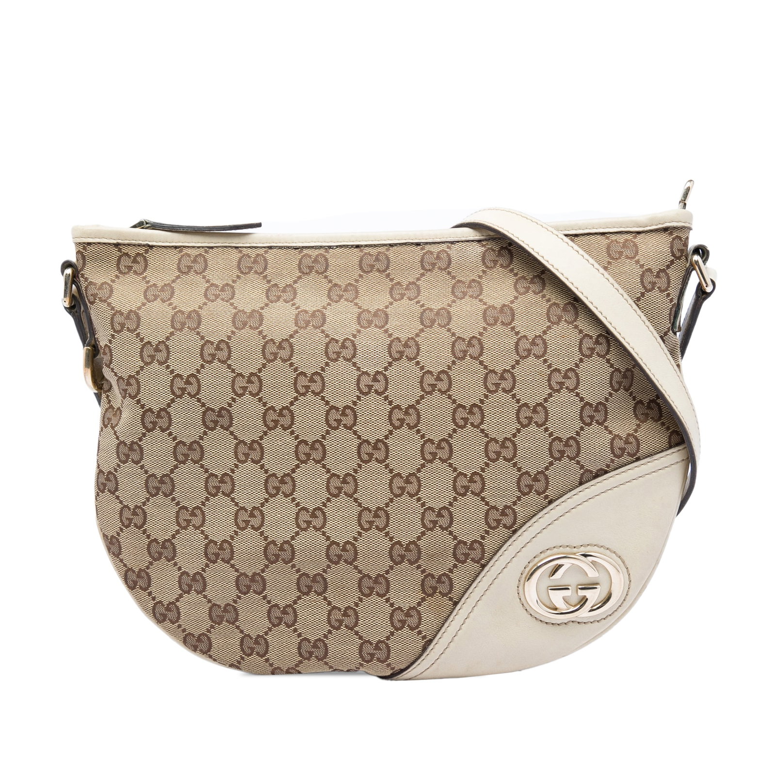 Gucci New Britt Half Moon Medium GG Canvas Crossbody Bag: Gucci New Britt Half Moon Medium GG Canvas Crossbody Bag This Gucci Medium GG Canvas New Britt Half Moon Crossbody is a beige crossbody bag made in Italy. It features a canvas body with leather trim, 