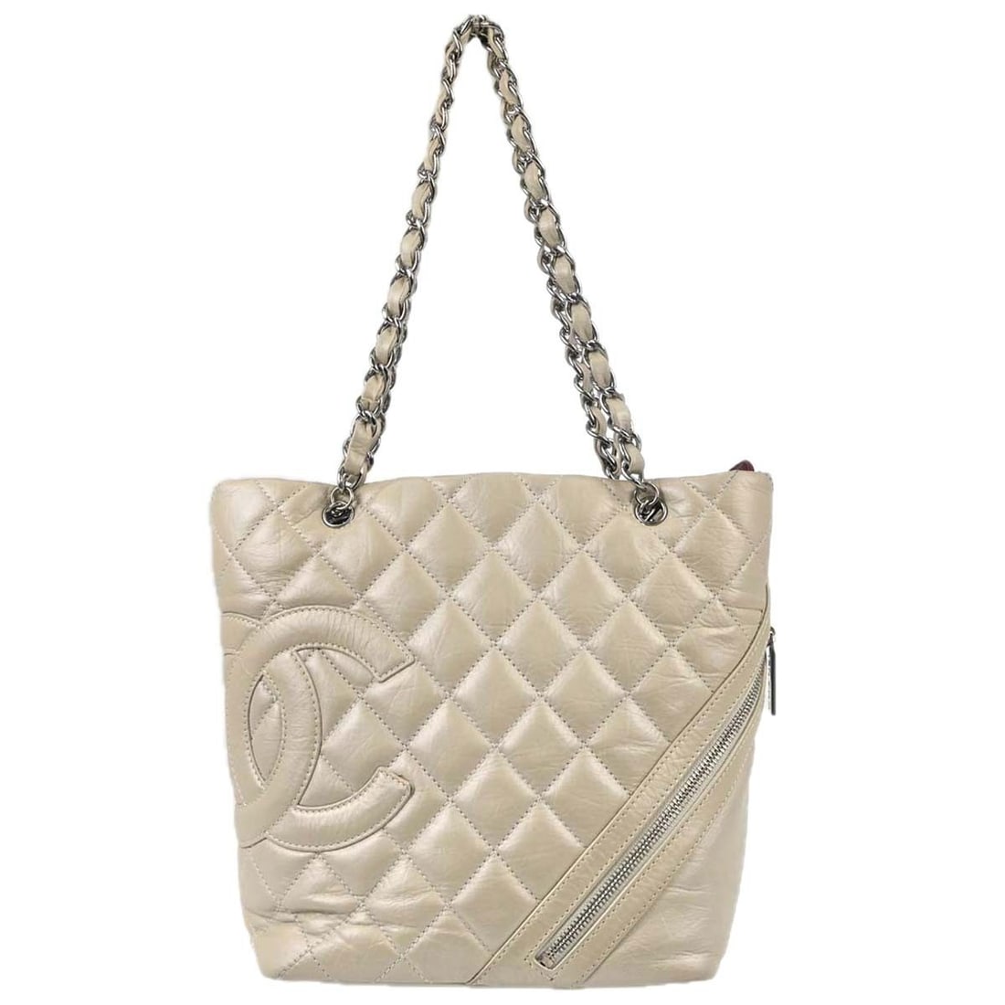 CHANEL Cambon Ligne off white calfskin quilted tote bag: CHANEL Cambon Ligne off white calfskin quilted tote bag Chanel Cambon Ligne tote handbag in off-white quilted calfskin leather with double white handles, silver-tone hardware, and a zip closure. The b