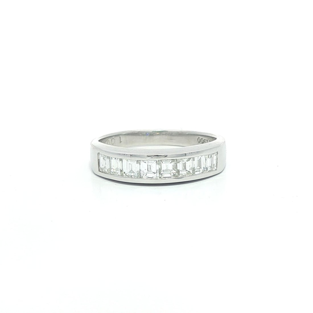 1ctw Baguette Cut Channel Set Diamond Platinum Band Ring: 1ctw Baguette Cut Channel Set Diamond Platinum Band Ring This exquisite ring features a solid platinum band set with eight natural baguette cut diamonds, showcasing a total carat weight of 1.0 carats.