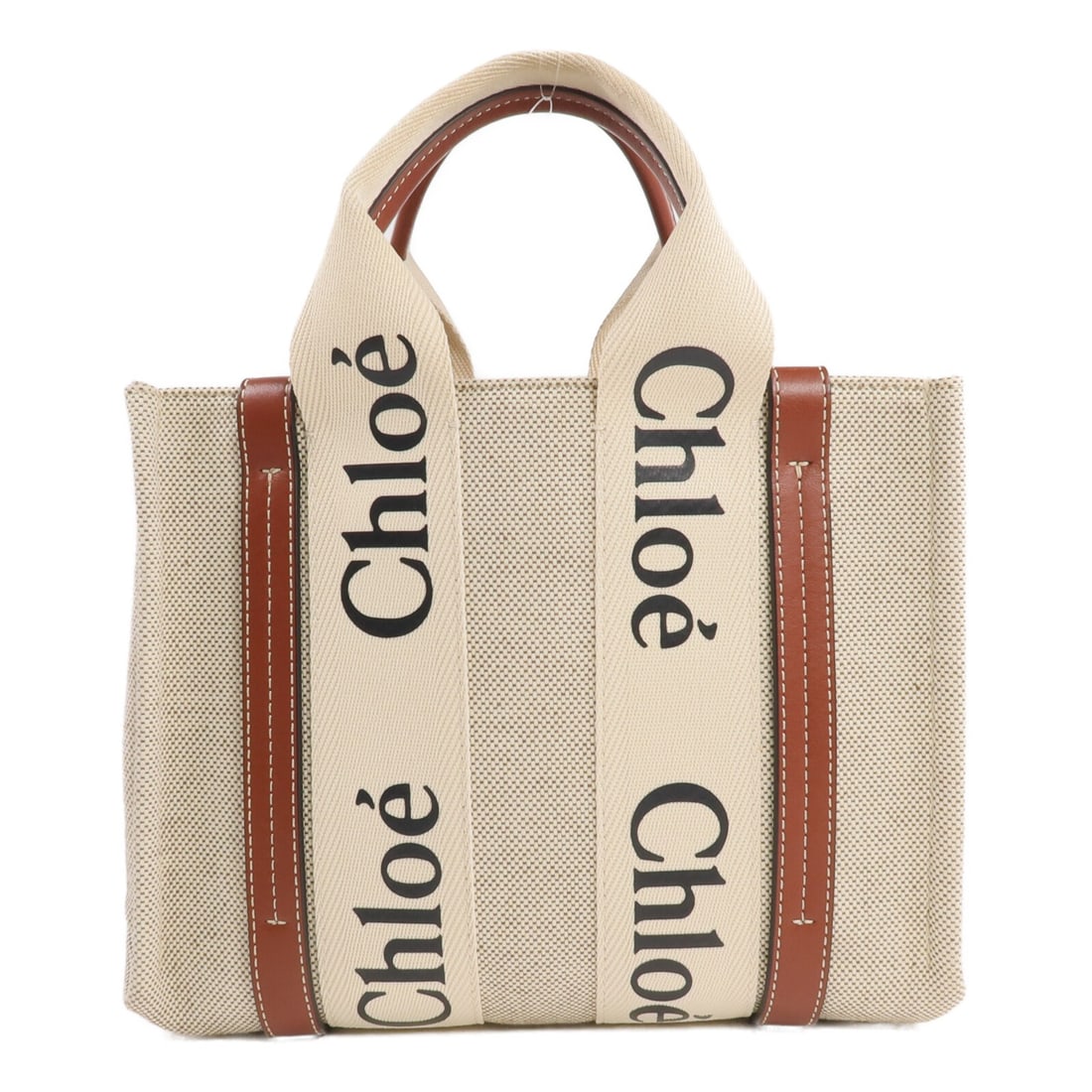 Chloe Woody Small Canvas Handbag Brown Beige: Chloe Woody Small Canvas Handbag Brown Beige Chloe Woody small tote handbag in brown, beige, and white canvas. This women's handbag features an open interior pocket and shows reasonable wear and tear 