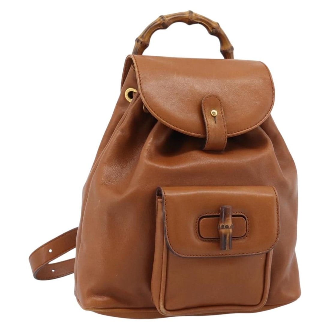 Gucci leather backpack brown and gold bamboo detail Italy: Gucci leather backpack brown and gold bamboo detail Italy Authentic Gucci bamboo backpack in brown leather with gold-tone accents. This women's backpack is made in Italy and shows heavy use, including