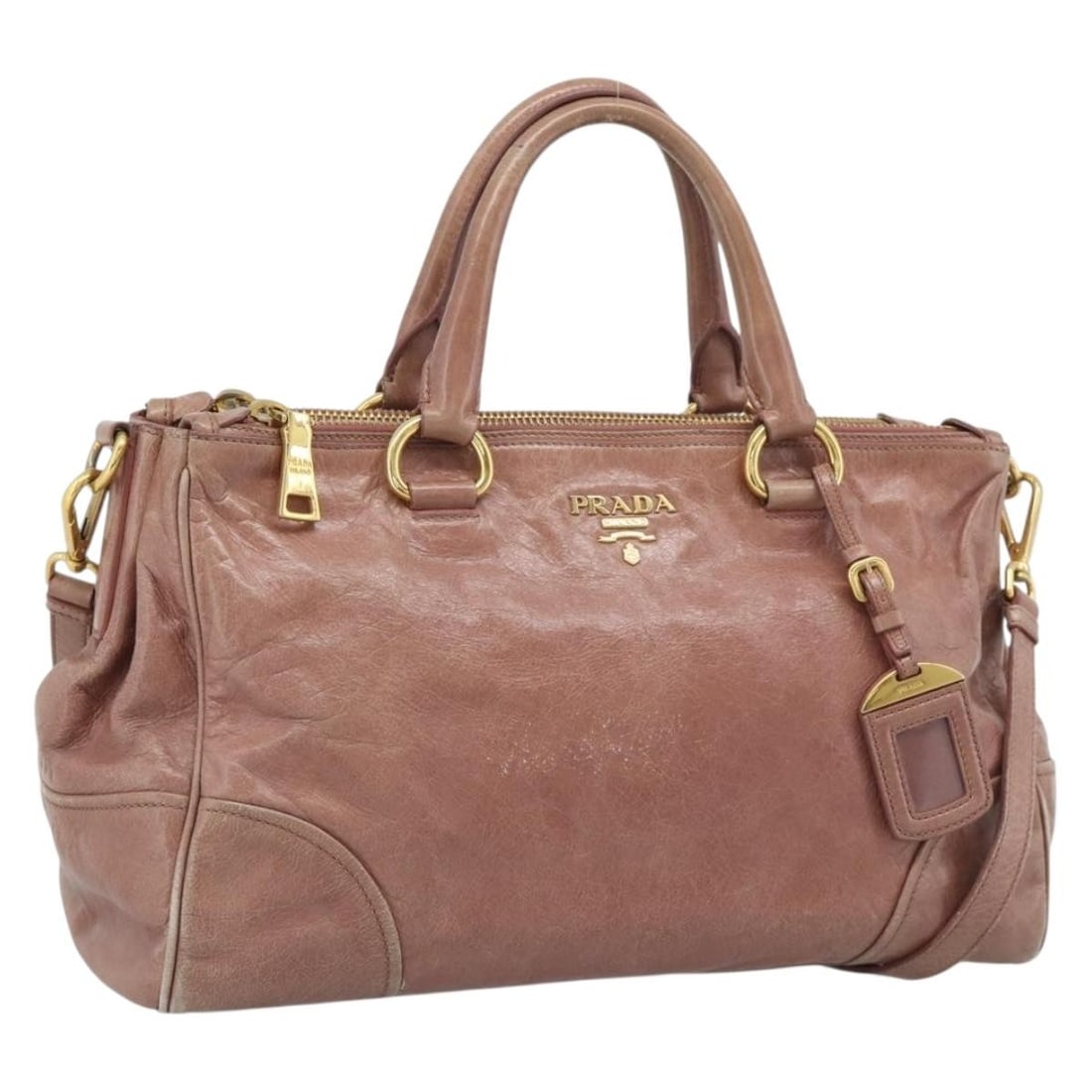 PRADA Leather 2Way Handbag Pink with Shoulder Strap: PRADA Leather 2Way Handbag Pink with Shoulder Strap Authentic Prada 2-way handbag in pink leather with gold-tone accents. This women's bag includes a shoulder strap and name tag, and can be carried by