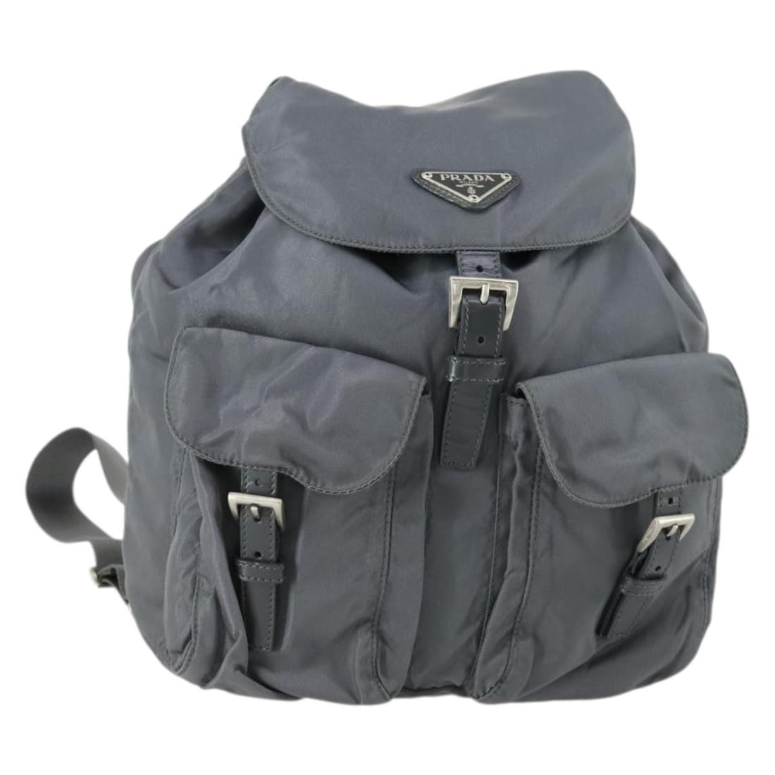 Gray Silver Nylon Prada Backpack Made in Italy: Gray Silver Nylon Prada Backpack Made in Italy This Prada backpack features a gray and silver nylon exterior with matching tones. Made in Italy, it offers a compact size and practical design. The back