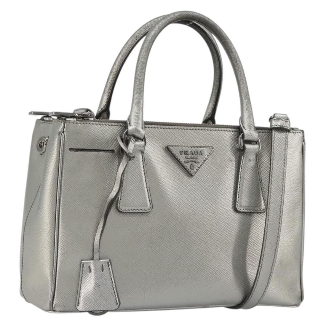 PRADA Galleria 2 Way Handbag Silver Saffiano Leather: PRADA Galleria 2 Way Handbag Silver Saffiano Leather Prada Galleria 2-way handbag in silver Saffiano leather. Made in Italy, this women's handbag includes a clochette and shoulder strap. Condition is 