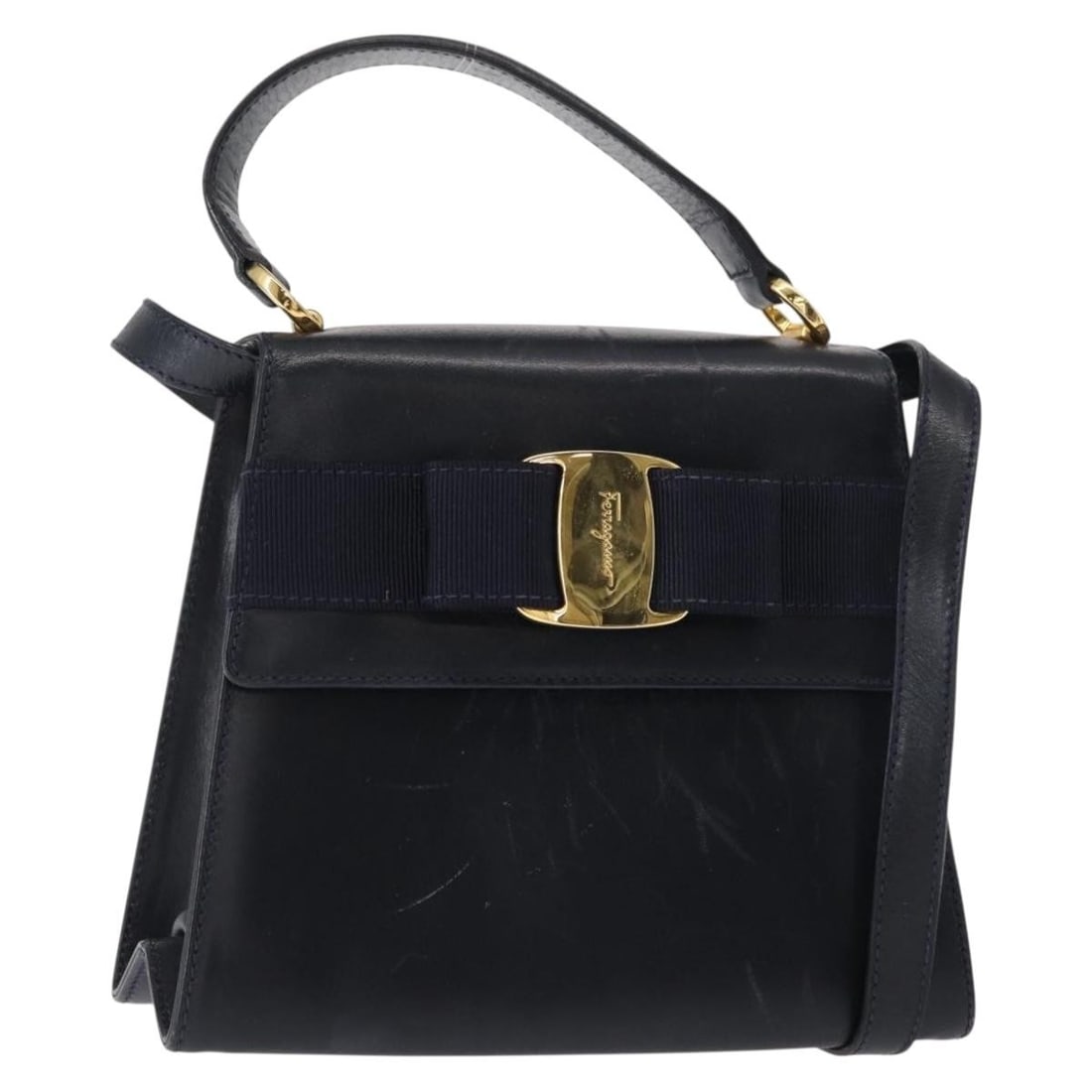 Salvatore Ferragamo Vala Navy Gold Leather Hand Bag Authentic: Salvatore Ferragamo Vala Navy Gold Leather Hand Bag Authentic This Salvatore Ferragamo Vala Hand Bag is a stylish and functional accessory crafted from high-quality leather. The bag features a sophist