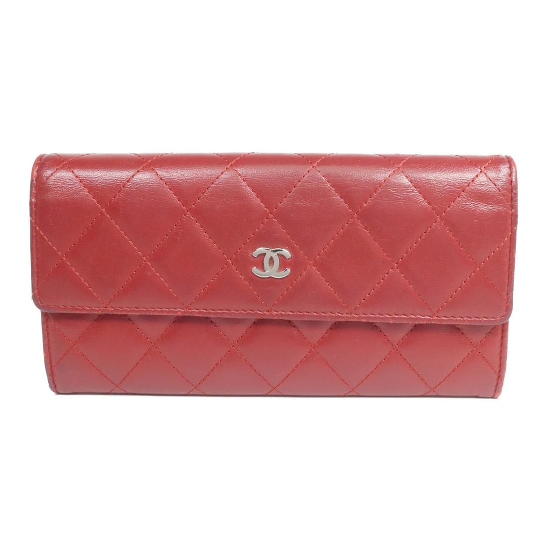 CHANEL CC Bifold Wallet Red Lambskin Leather Silver Tone: CHANEL CC Bifold Wallet Red Lambskin Leather Silver Tone A CHANEL long bifold wallet in red lambskin (sheep leather), made in France. It features a hook button closure and a practical interior layout 