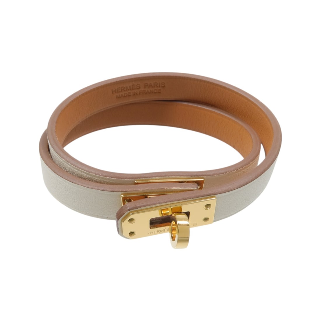 Hermes Mini Double Kelly Tour Bracelet Nata Swift Leather Metal: Hermes Mini Double Kelly Tour Bracelet Nata Swift Leather Metal Hermes Mini Double Kelly Tour bracelet in Nata with Swift leather and metal accents. This women's bracelet is made in France and include