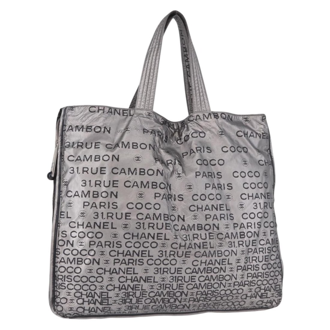CHANEL Unlimited Silver Nylon Tote with Guarantee Card: CHANEL Unlimited Silver Nylon Tote with Guarantee Card CHANEL Unlimited tote bag in silver nylon with a spacious silhouette and dual handles. Made in Italy, this women's tote includes the guarantee ca