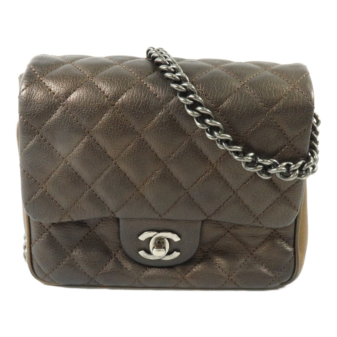 CHANEL CC calfskin shoulder bag gold chain strap turn lock: CHANEL CC calfskin shoulder bag gold chain strap turn lock Chanel CC chain shoulder bag in gold calfskin leather with a turn-lock closure and a practical interior and exterior pocket layout. This wome
