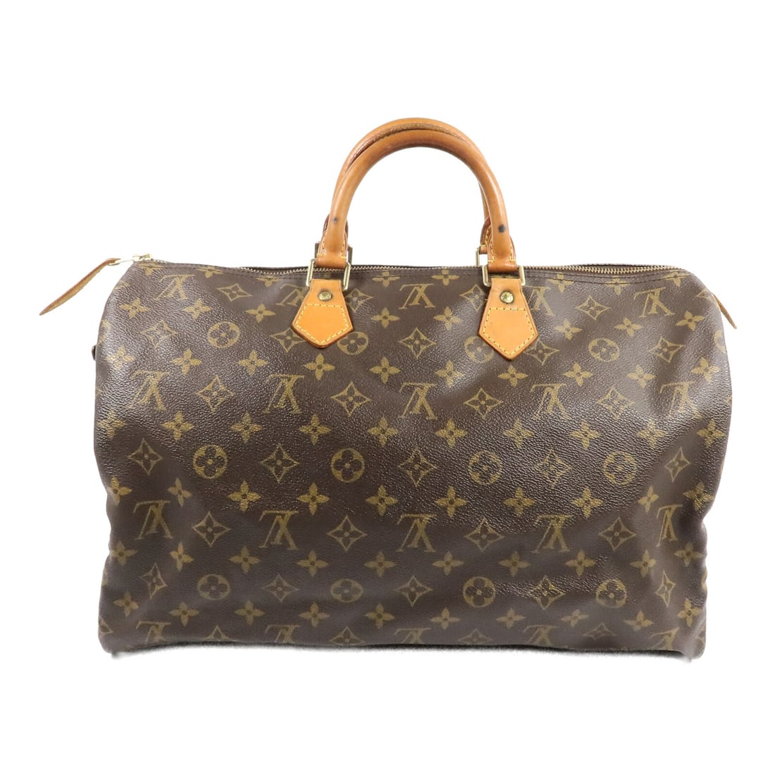 Louis Vuitton M41522 Speedy 40 Monogram Brown Boston Handbag: Louis Vuitton M41522 Speedy 40 Monogram Brown Boston Handbag Louis Vuitton Speedy 40 handbag in brown Monogram PVC coated canvas. This Boston bag style features an interior open pocket and includes a 