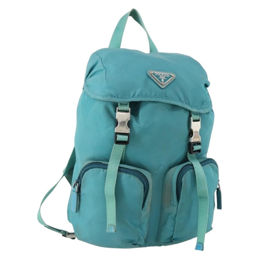 PRADA INZ057 Womens Nylon Backpack Light Blue Silver: PRADA INZ057 Womens Nylon Backpack Light Blue Silver Authentic Prada women's backpack in light blue nylon with silver-tone accents, made in Italy. This pre-owned bag is heavily used and shows visible 