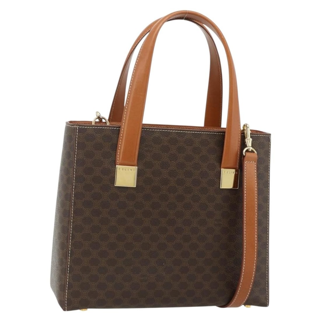 CELINE Macadam 2way Brown PVC Leather Handbag with Shoulder Strap: CELINE Macadam 2way Brown PVC Leather Handbag with Shoulder Strap Celine Macadam canvas hand bag with PVC leather trim in brown and gold tone. This 2-way design includes a shoulder strap and is made i