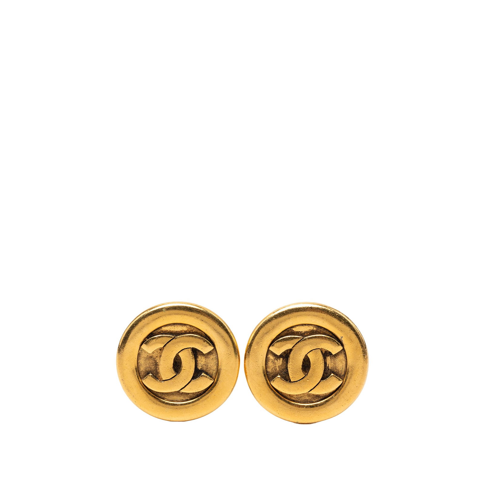 Chanel CC Round Clip On Earrings Gold Plated Metal: Chanel CC Round Clip On Earrings Gold Plated Metal Round Chanel CC clip-on earrings in gold plated metal. This costume jewelry pair is made in France and features the iconic CC motif with clip-on back