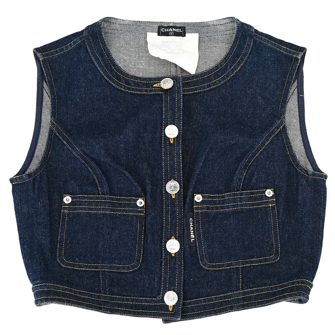 CHANEL Vintage Indigo Cotton Collarless Vest Jacket Size 40: CHANEL Vintage Indigo Cotton Collarless Vest Jacket Size 40 Vintage Chanel sleeveless denim vest jacket in indigo cotton with a collarless design, button front, and two exterior pockets. This women's 
