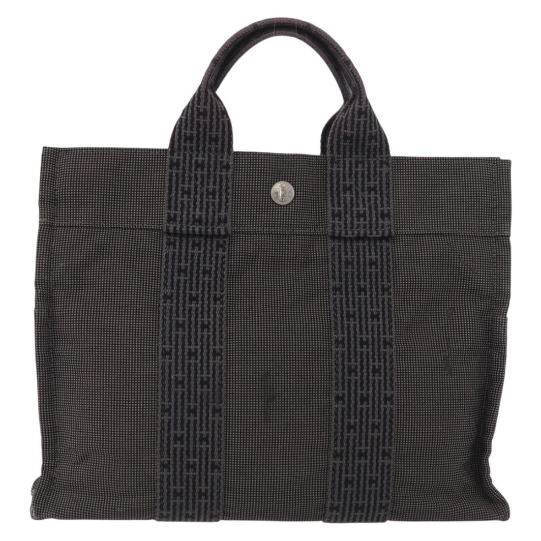 Fourre-tout Herline gray canvas tote bag by Hermes France: Fourre-tout Herline gray canvas tote bag by Hermes France This Hermes Fourre-tout Herline Canvas bag features a gray canvas exterior with a structured silhouette. Designed for women, it offers practic