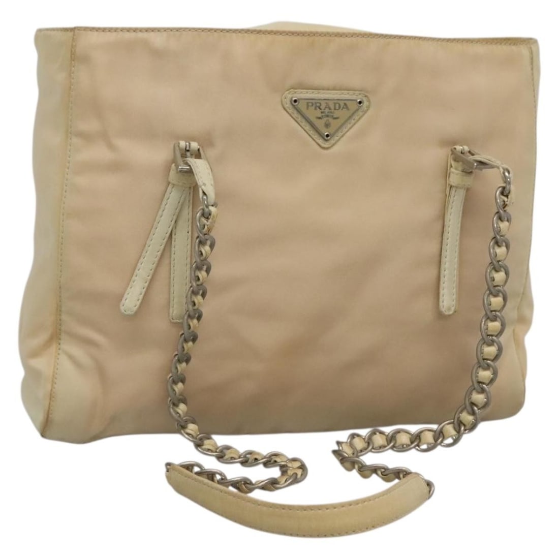 Prada Ivory Nylon Shoulder Bag with Silver Chain Italy: Prada Ivory Nylon Shoulder Bag with Silver Chain Italy This PRADA chain shoulder bag is crafted from ivory nylon with silver-tone details. Designed for women, it features a compact silhouette with a s