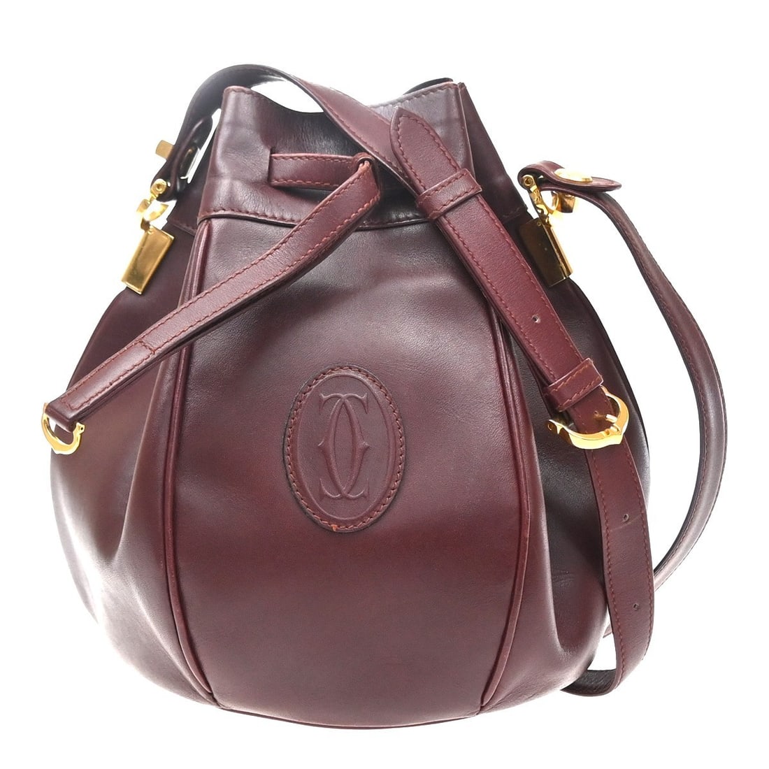 Cartier Must de cartier Burgundy Leather Handbag: Cartier Must de cartier Burgundy Leather Handbag Must de Cartier leather bag in burgundy with a structured silhouette. Made in Spain, this women's piece is presented in good condition with visible sig