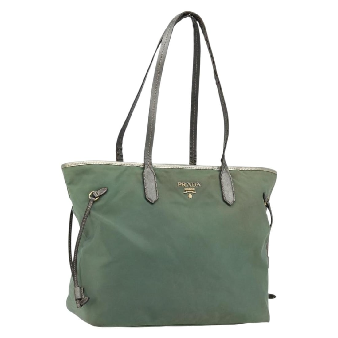 Prada BA12579 nylon tote handbag green with gold tone: Prada BA12579 nylon tote handbag green with gold tone Prada tote bag in green nylon with gold-tone accents. This women's bag is made in Italy and features a spacious tote silhouette with double handle
