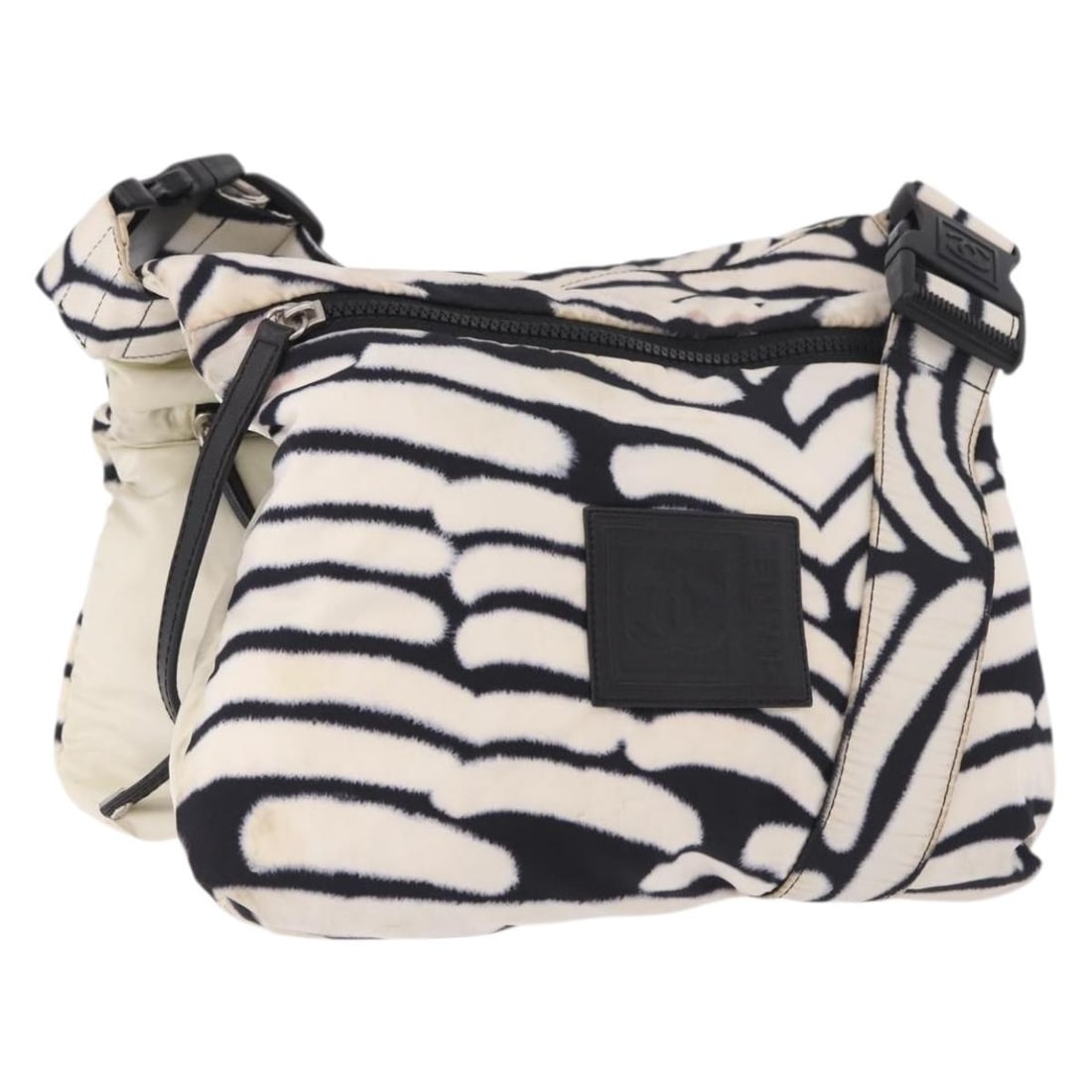 CHANEL Sports Reversible Nylon Shoulder Bag White Zebra CC: CHANEL Sports Reversible Nylon Shoulder Bag White Zebra CC Chanel reversible shoulder bag in white and zebra nylon, made in Italy. The bag measures approximately 29 cm wide, 25 cm high, and 3 cm deep,