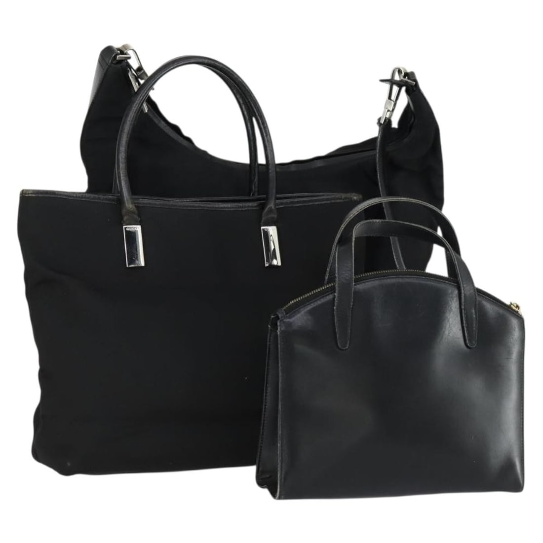 Set of Three Black Leather and Nylon Gucci Handbags from Italy: Set of Three Black Leather and Nylon Gucci Handbags from Italy This is a set of three authentic GUCCI handbags crafted from black leather and nylon. Made in Italy, these bags exhibit noticeable signs 