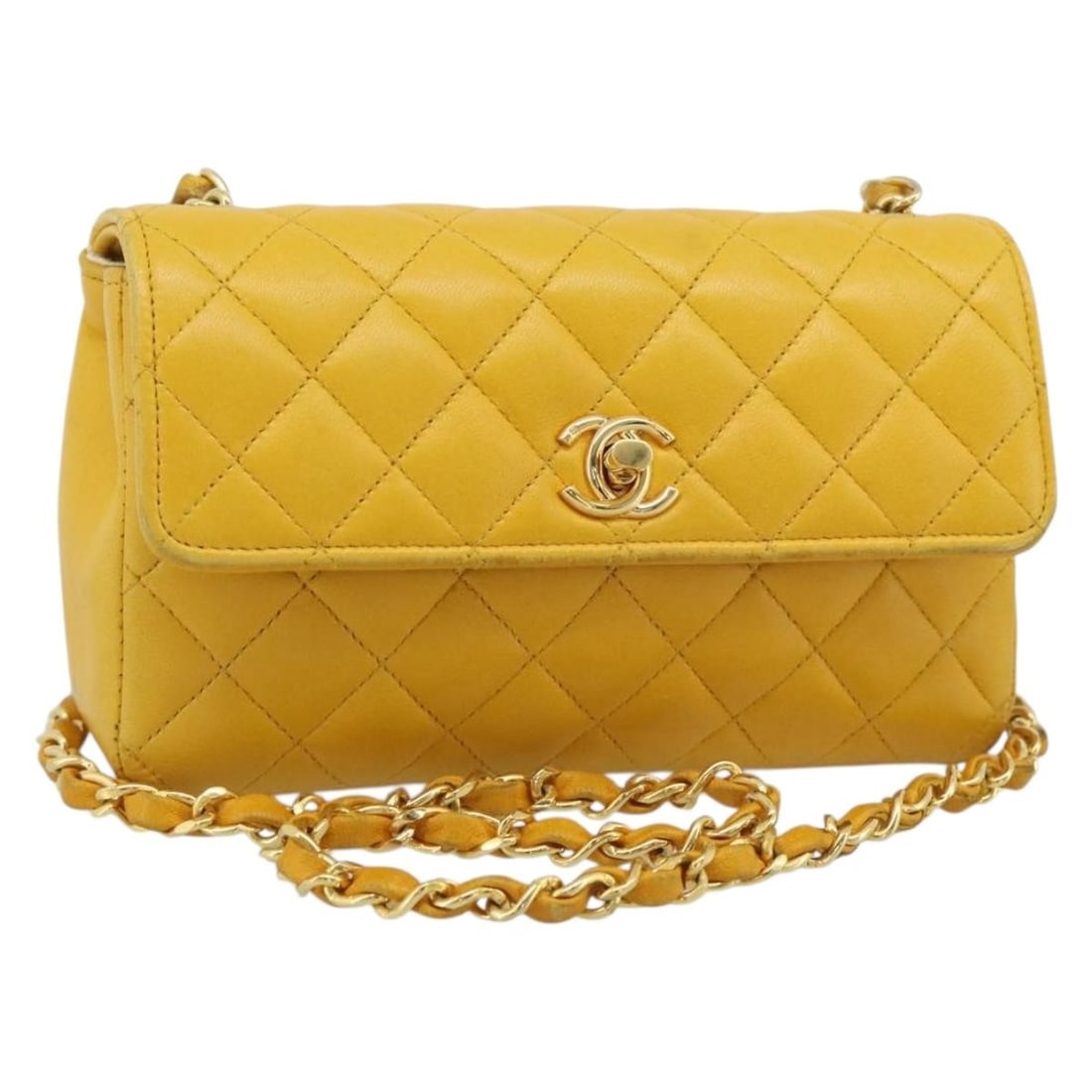 CHANEL CC Lamb Skin Shoulder Bag Yellow Gold Chain Strap: CHANEL CC Lamb Skin Shoulder Bag Yellow Gold Chain Strap CHANEL Matelasse chain shoulder bag in yellow/gold lamb skin with CC detailing. This women's shoulder bag is a heavily used piece with visible 
