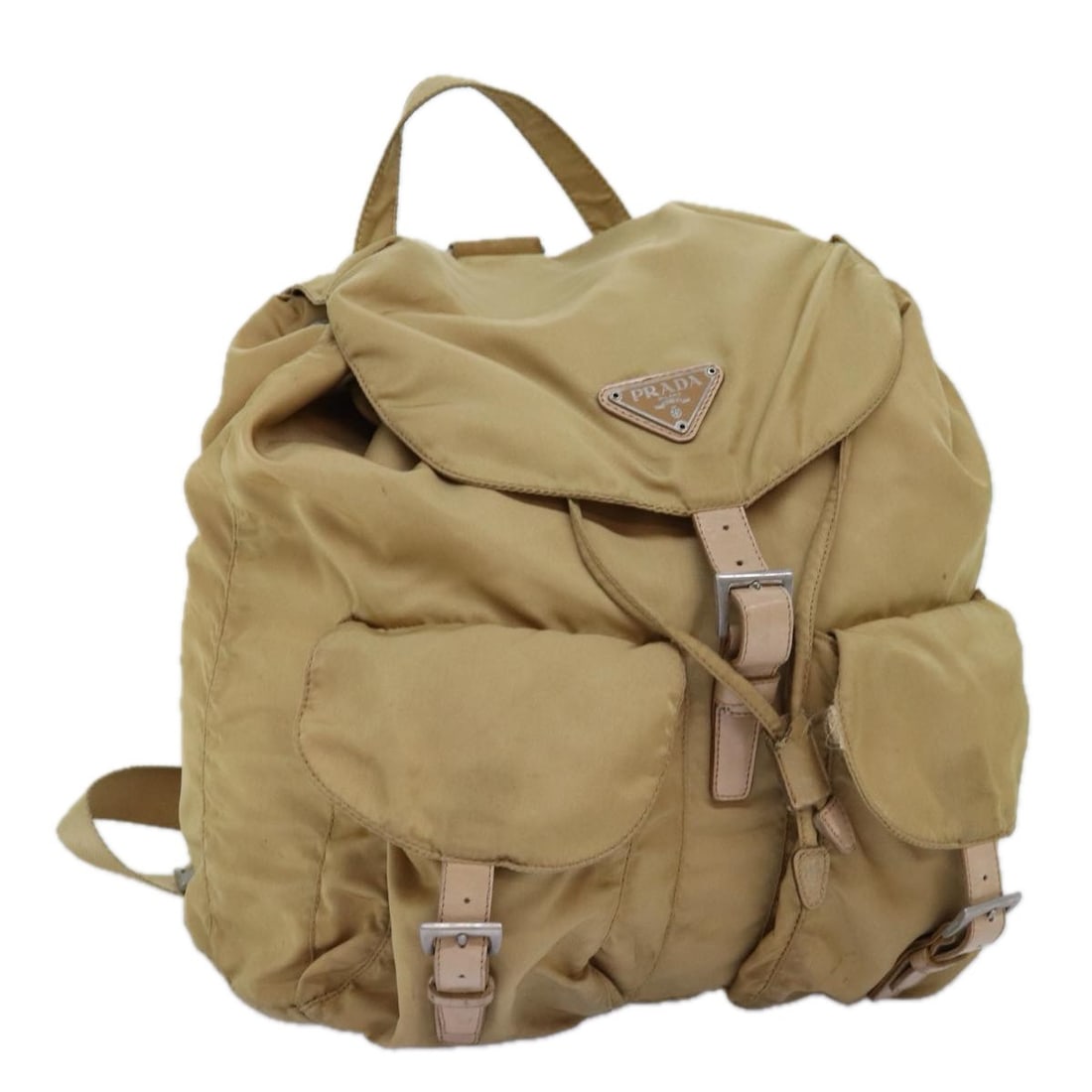 Prada beige nylon women's backpack Italy: Prada beige nylon women's backpack Italy This PRADA backpack is crafted from durable beige nylon and designed for women. Made in Italy, it features an approximate height of 28cm, width of 30cm, and de