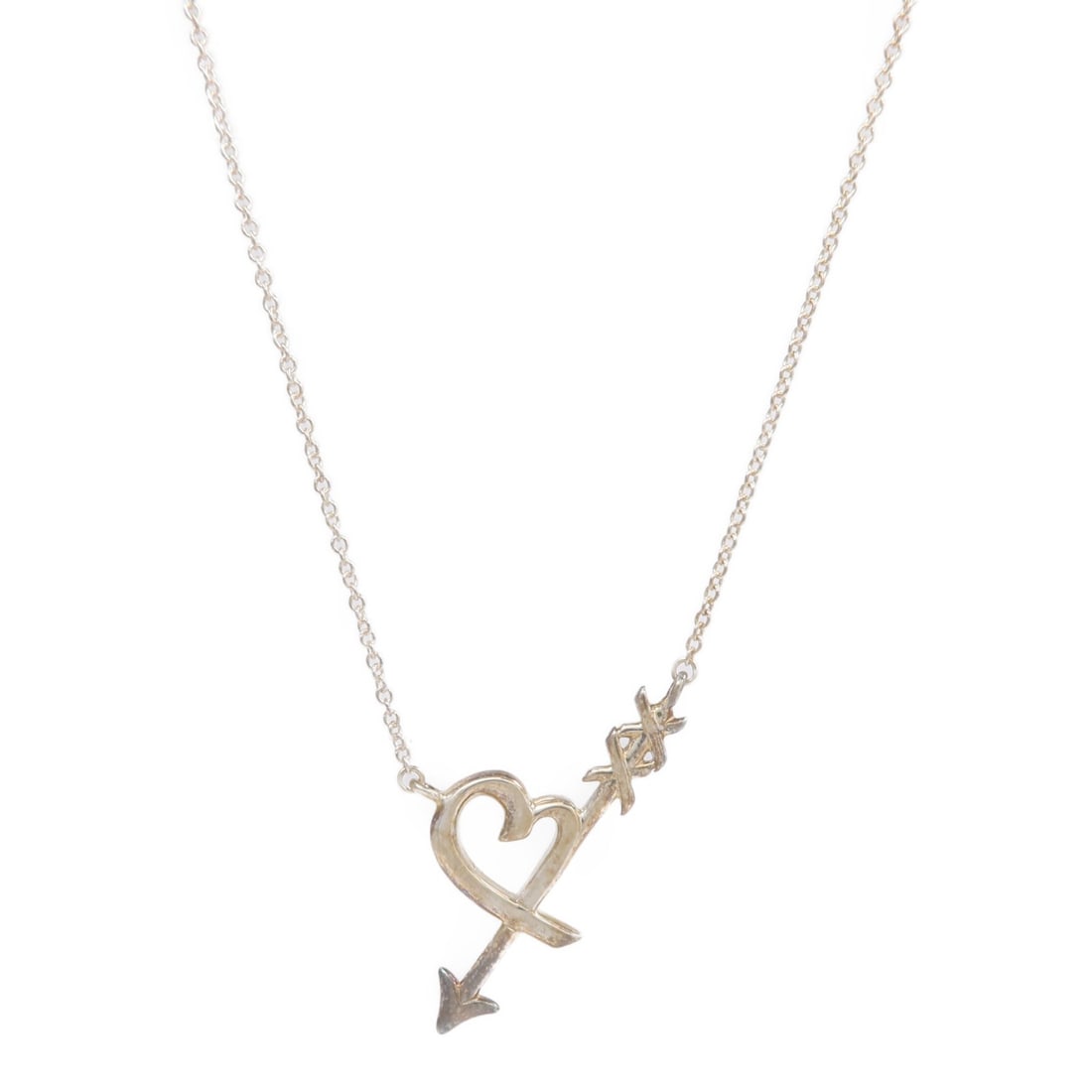 Tiffany and Co Heart Arrow Necklace in 925 Sterling Silver: Tiffany and Co Heart Arrow Necklace in 925 Sterling Silver Tiffany & Co. Heart & Arrow necklace in Silver925, designed for women and presented in a silver color finish. The necklace is made in the Uni