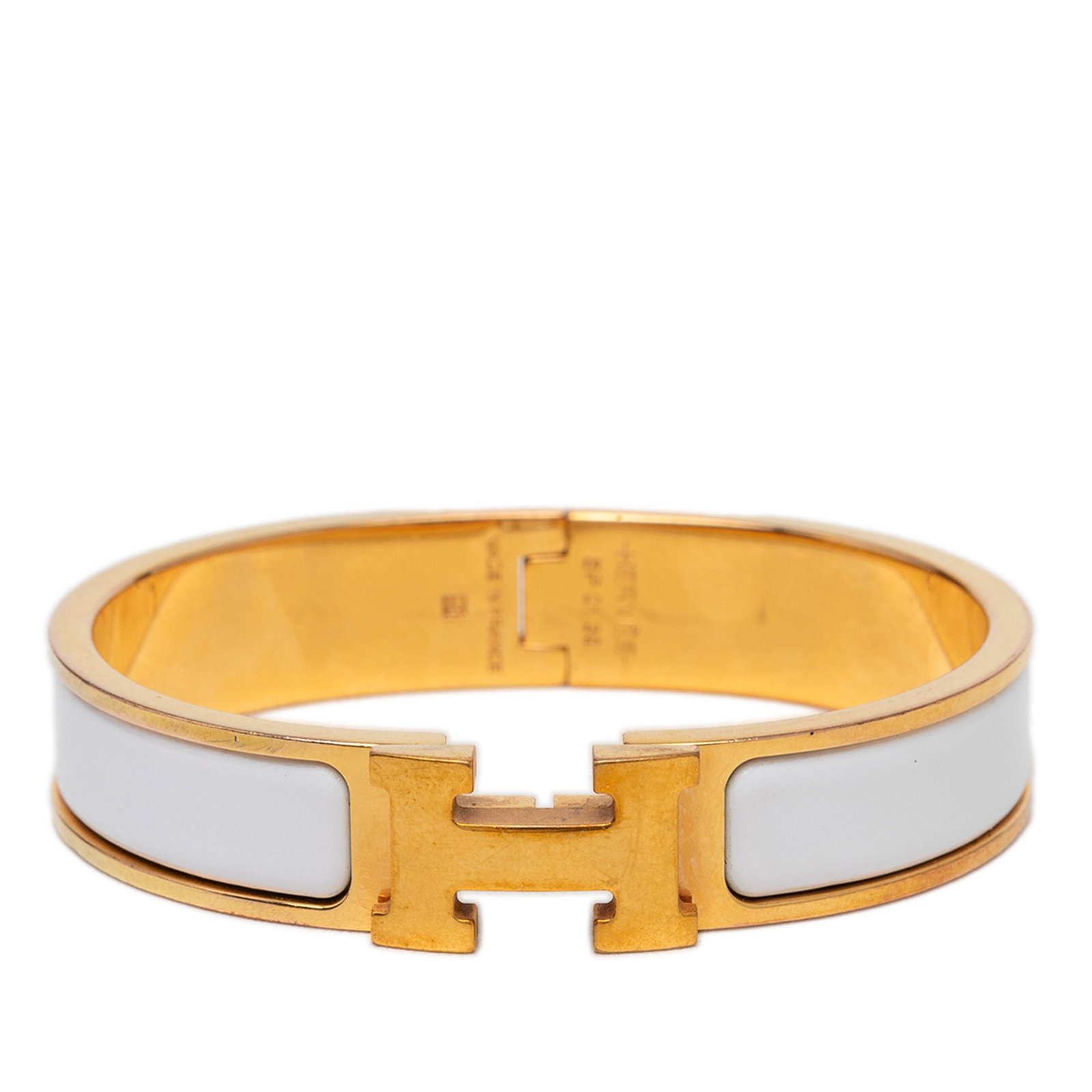 Hermes Clic H PM narrow enamel bracelet white gold plated: Hermes Clic H PM narrow enamel bracelet white gold plated Hermes Narrow Enamel Clic H Bracelet PM featuring an enamel body with gold plated metal and an H toggle clasp closure. Condition is B+ with sc