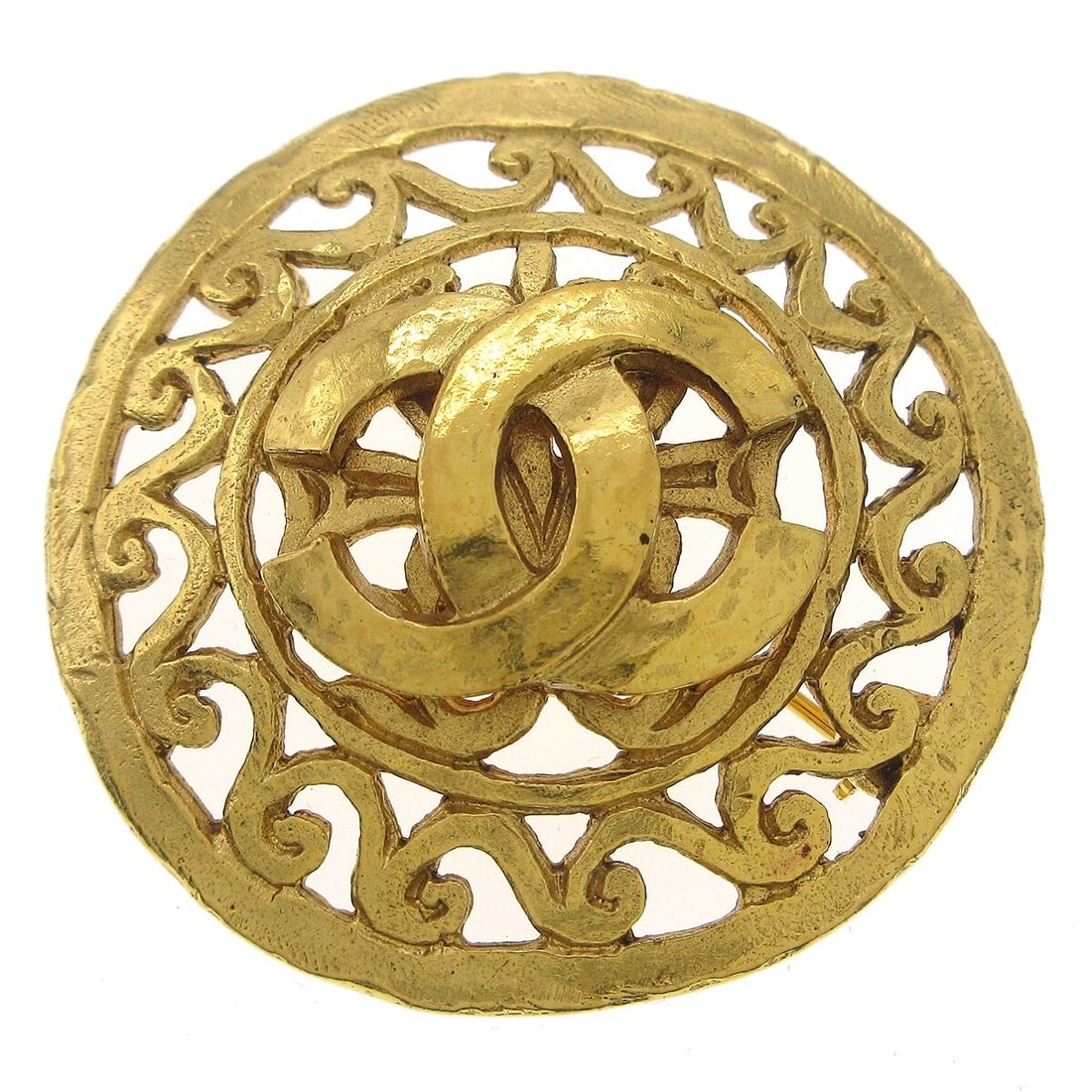 CHANEL 95A Round Gold Plated Medallion Brooch: CHANEL 95A Round Gold Plated Medallion Brooch Round Chanel medallion brooch pin in gold-plated metal with a circular design. Made in France, this piece is marked 95A and is presented in very good cond