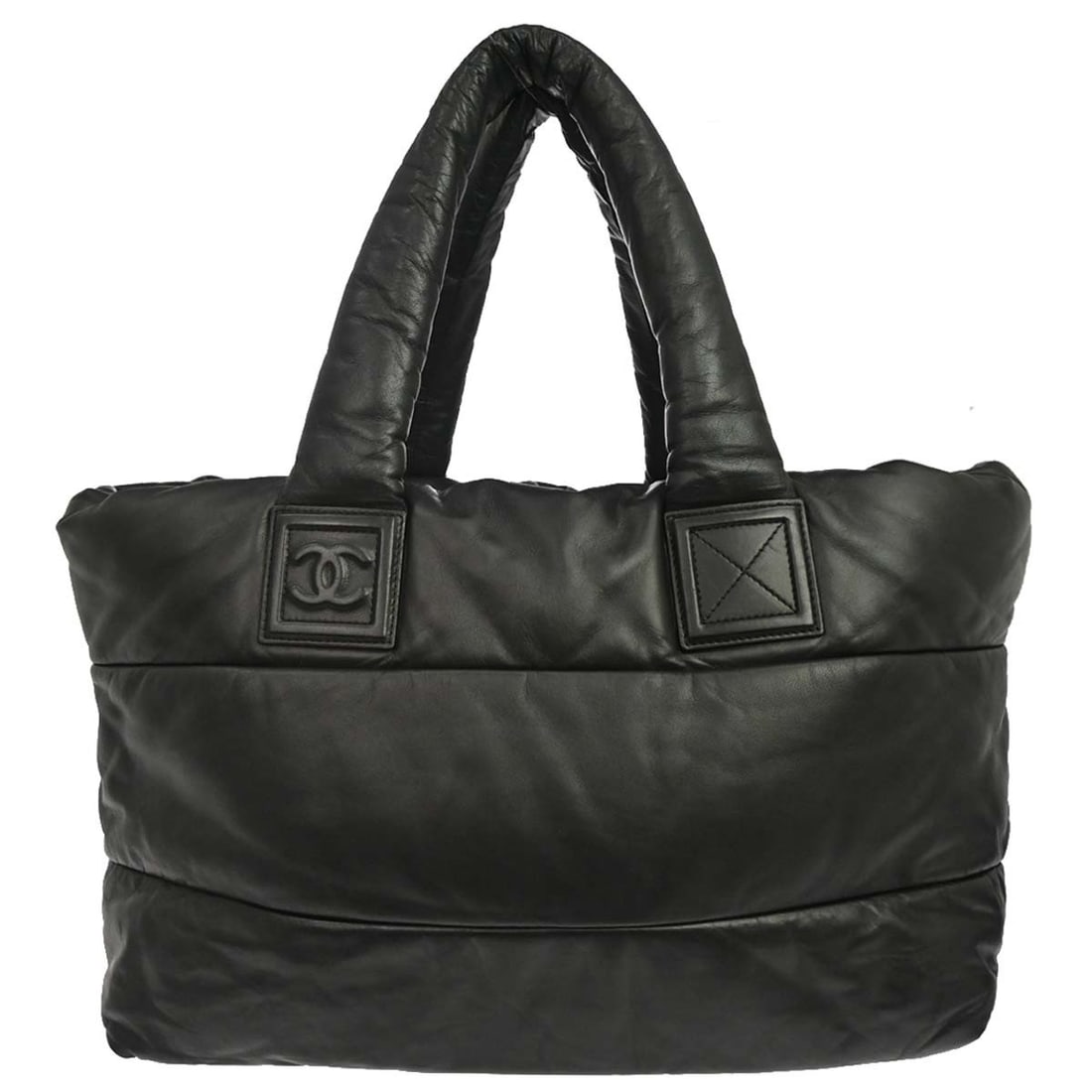 Chanel Coco Cocoon black reversible leather tote bag: Chanel Coco Cocoon black reversible leather tote bag Chanel Coco Cocoon Reversible Tote in black leather. This women's tote features the signature quilted Coco Cocoon design and a reversible construct