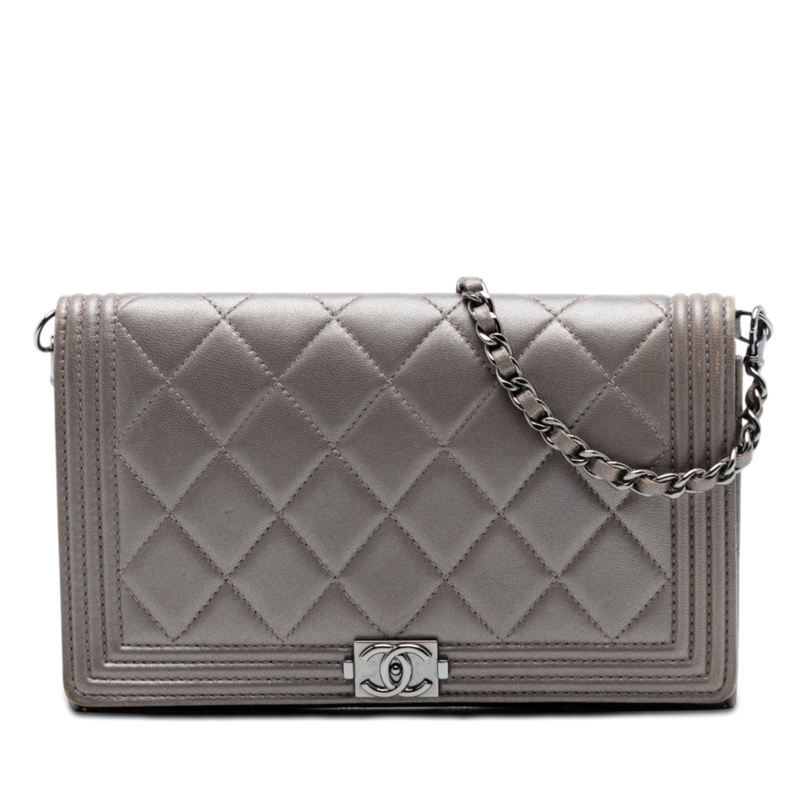 Chanel Boy metallic lambskin clutch on chain: Chanel Boy metallic lambskin clutch on chain This Chanel Boy Clutch On Chain features a quilted metallic lambskin leather exterior in brown, accented by a leather-woven chain link strap and a front fl