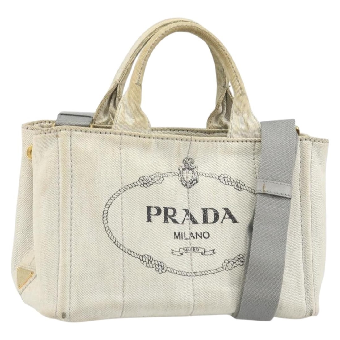 Gray Gold Canvas Prada Canapa PM Handbag with Shoulder Strap: Gray Gold Canvas Prada Canapa PM Handbag with Shoulder Strap This Prada Canapa PM handbag features a gray canvas exterior with gold-tone accents. Designed as a 2-way handbag, it includes a shoulder st