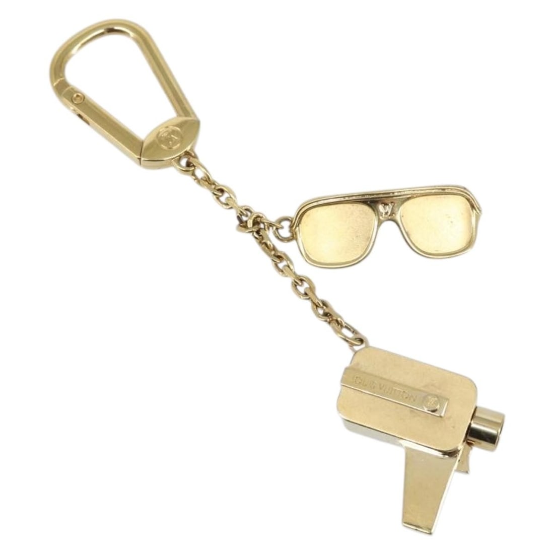 Louis Vuitton Cannes Gold Metal Key Holder Model M65383: Louis Vuitton Cannes Gold Metal Key Holder Model M65383 This Louis Vuitton Porte Cles Cannes key holder is crafted from gold-toned metal and designed for women. The piece features a total length of ap