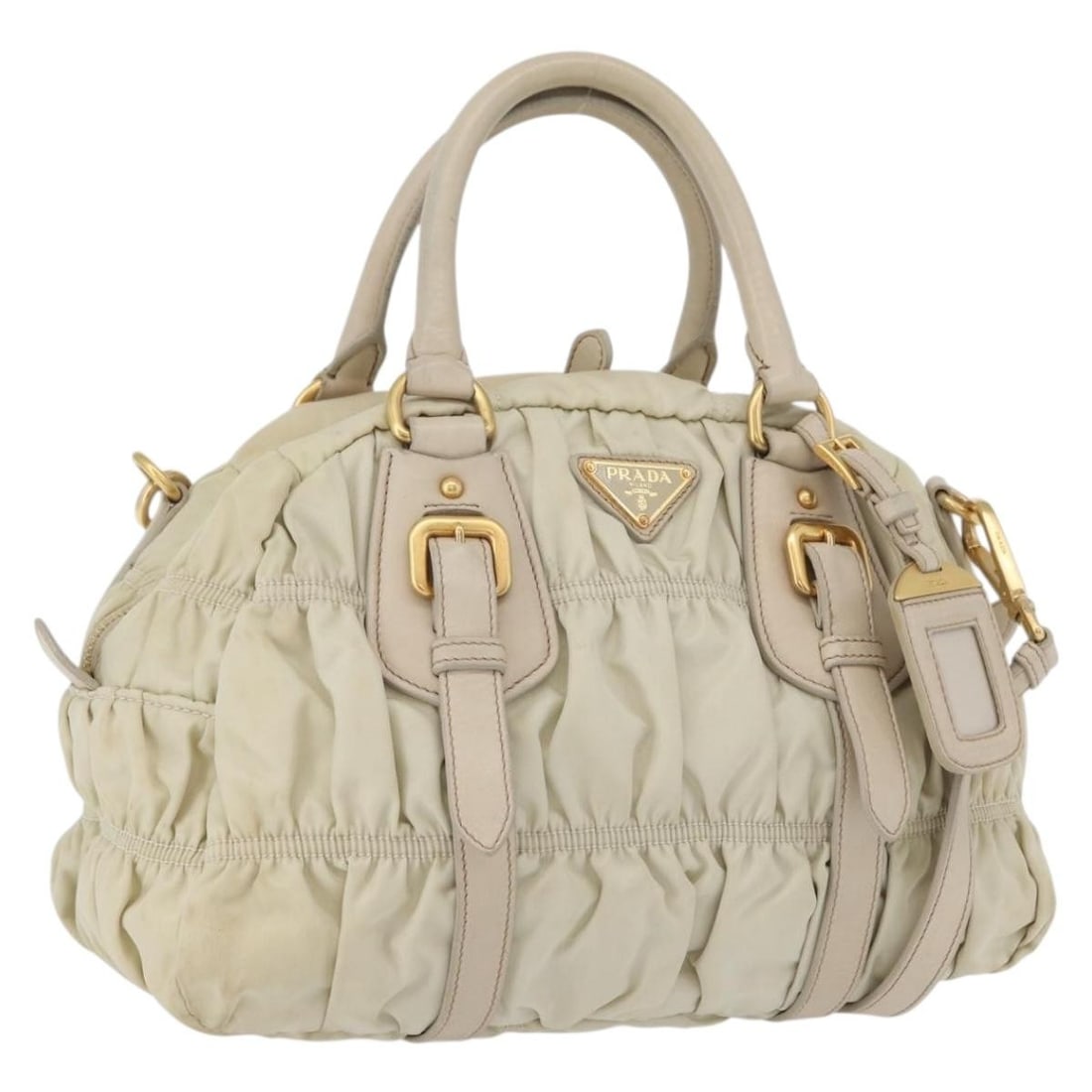 PRADA Nylon 2way Hand Bag Ivory Gold with Shoulder Strap: PRADA Nylon 2way Hand Bag Ivory Gold with Shoulder Strap PRADA gathered hand bag in ivory and gold nylon, made in Italy. This 2way women's hand bag comes with a shoulder strap and name tag. It measure