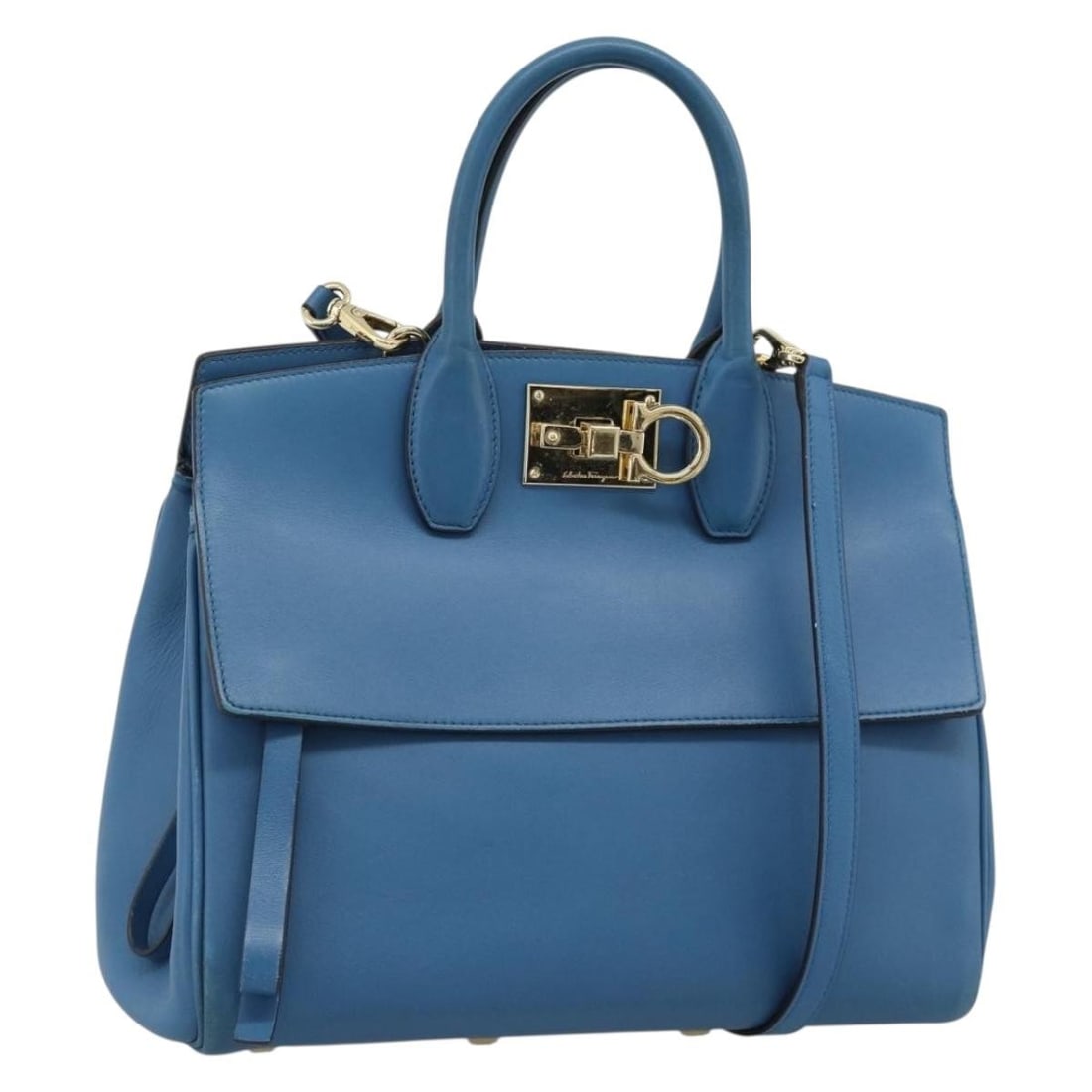Salvatore Ferragamo Gancini Blue Leather 2way Handbag with Shoulder Strap: Salvatore Ferragamo Gancini Blue Leather 2way Handbag with Shoulder Strap Salvatore Ferragamo Gancini 2-way handbag in blue leather with gold-tone accents. Designed for women, this Italian-made bag in