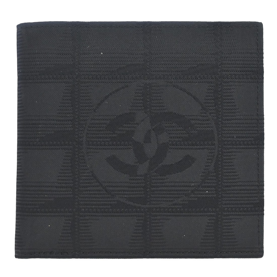 CHANEL Travel Line bifold wallet in black jacquard nylon: CHANEL Travel Line bifold wallet in black jacquard nylon Black Chanel bifold wallet for women made of jacquard nylon. It has an outside pocket and an interior layout with a bill pocket, four card pock