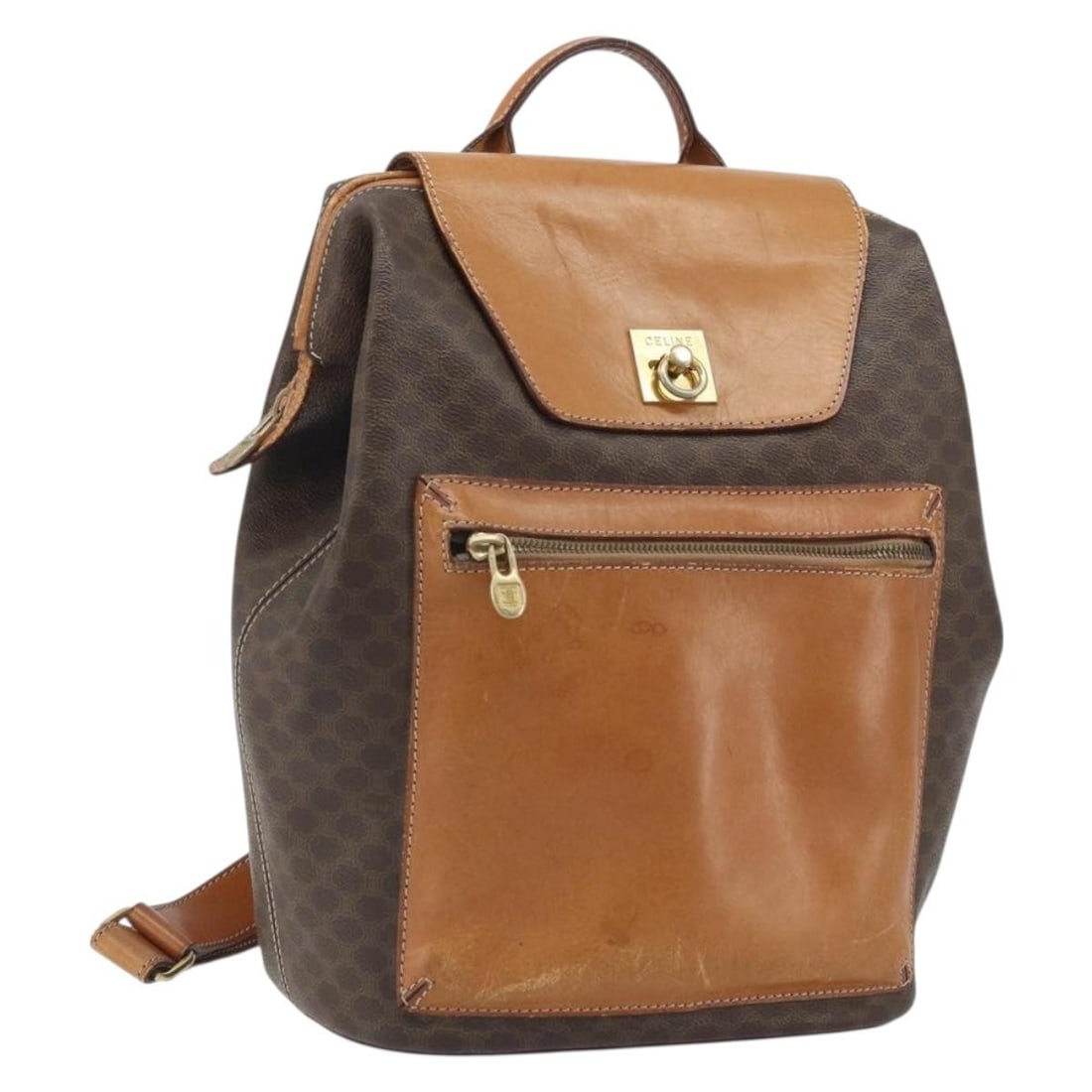 CELINE Macadam Backpack Brown PVC Leather Gold Tone Italy: CELINE Macadam Backpack Brown PVC Leather Gold Tone Italy This CELINE backpack is crafted from PVC leather and Macadam canvas in a brown and gold colorway. It was made in Italy and is designed for wom