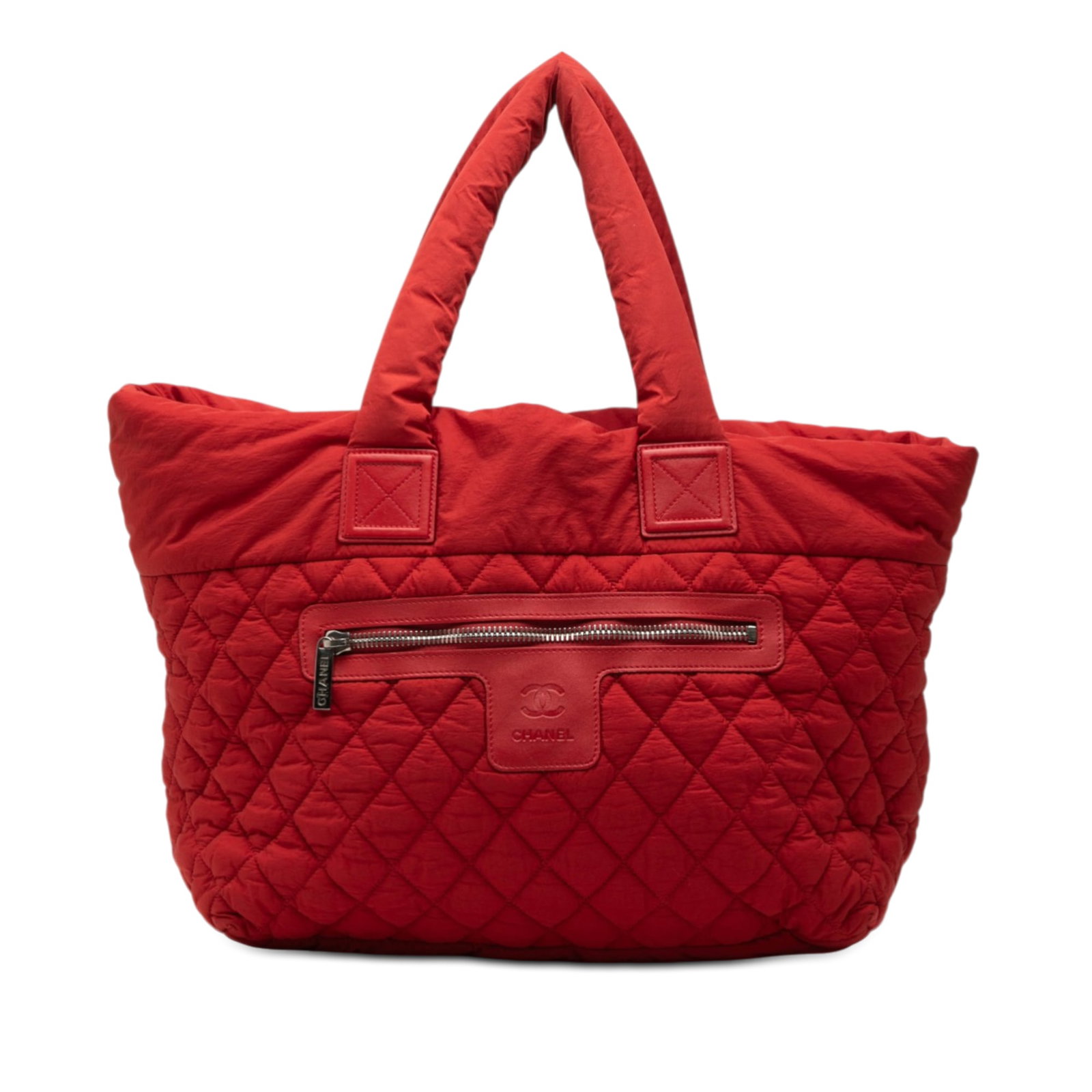 Chanel red quilted nylon Coco Cocoon medium tote: Chanel red quilted nylon Coco Cocoon medium tote This Chanel Medium Quilted Nylon Coco Cocoon Tote features a quilted nylon exterior in red, complemented by rolled nylon handles and a top zip closure.