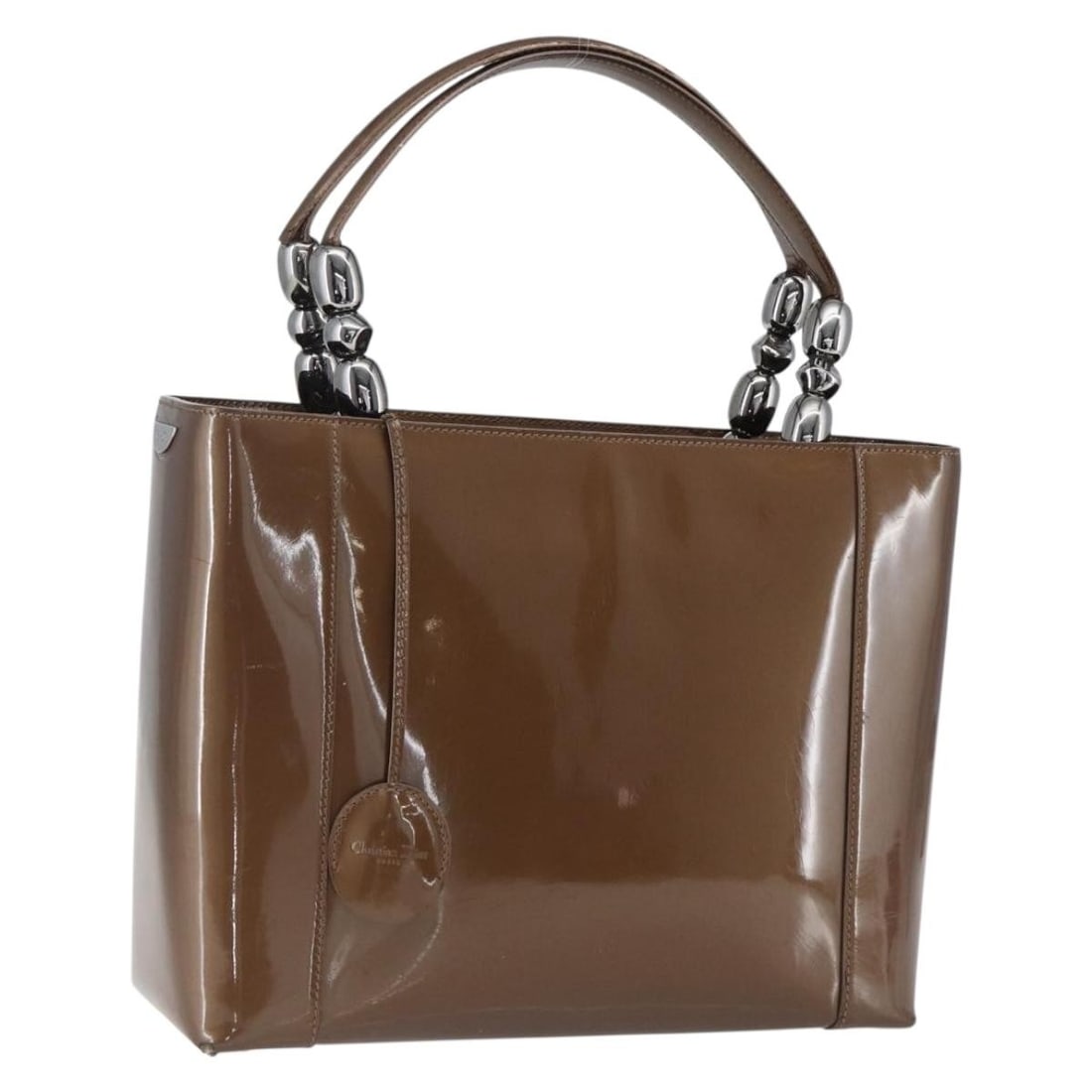 Dior Maris Pearl Patent Leather Brown Silver Handbag with Key and Clochette: Dior Maris Pearl Patent Leather Brown Silver Handbag with Key and Clochette This Christian Dior Maris Pearl handbag features a brown and silver patent leather exterior and is crafted in Italy. The bag