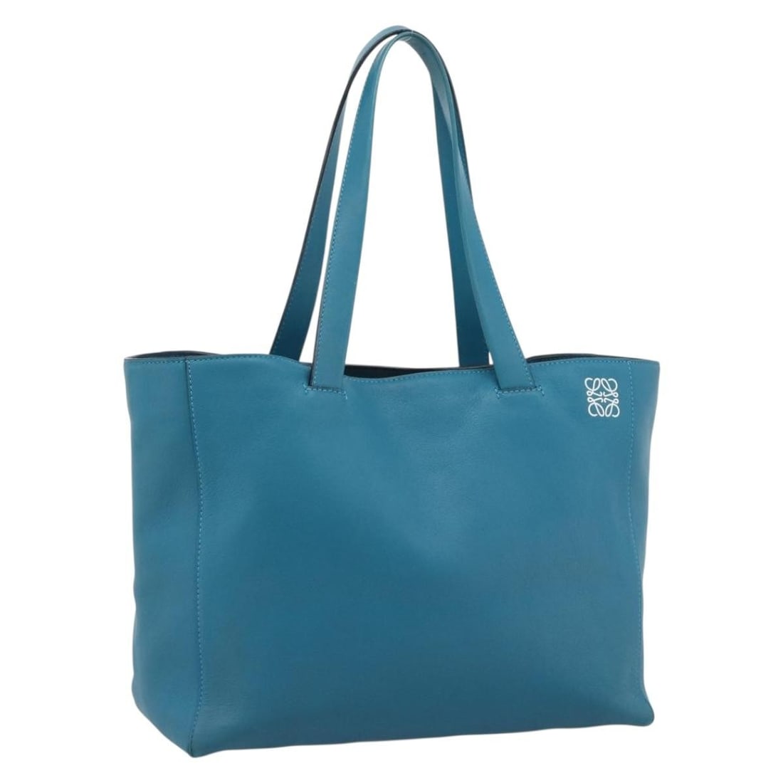 LOEWE Anagram East West leather tote in turquoise blue silver: LOEWE Anagram East West leather tote in turquoise blue silver Authentic LOEWE Anagram East West tote bag in turquoise blue leather with silver-tone accents. This women's tote includes a dust bag and i