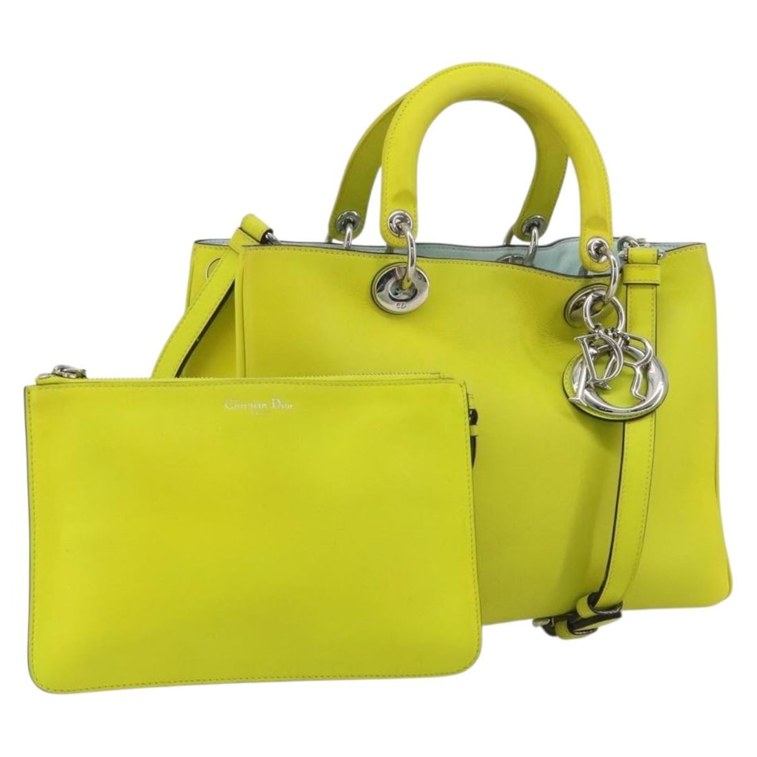 Christian Dior Diorissimo leather 2way handbag yellow with strap pouch: Christian Dior Diorissimo leather 2way handbag yellow with strap pouch Christian Dior Diorissimo 2-way handbag in yellow leather with silver-tone accents. This women's bag includes a shoulder strap an
