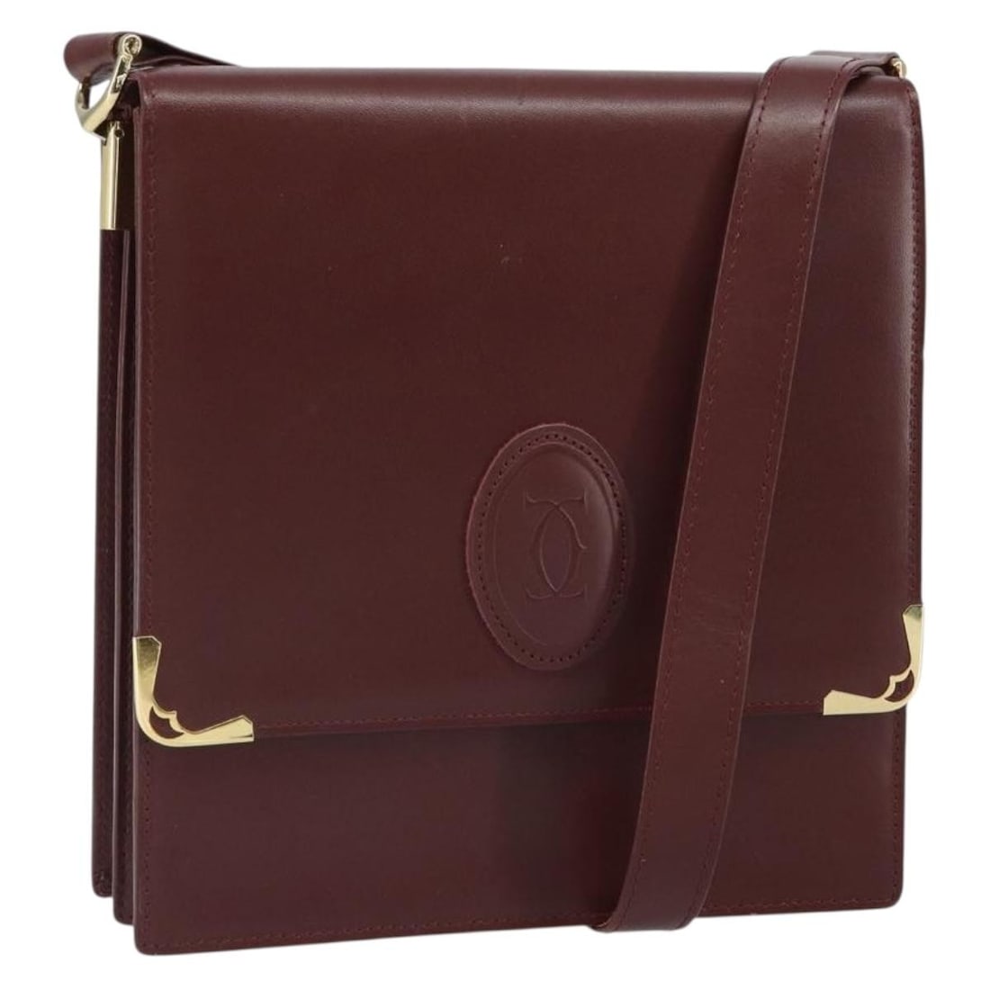 Leather Bordeaux Cartier Must Line Shoulder Bag with Gold Tone Hardware: Leather Bordeaux Cartier Must Line Shoulder Bag with Gold Tone Hardware This Cartier Must Line shoulder bag is crafted from leather in a Bordeaux color with gold-tone hardware. It features a compact d
