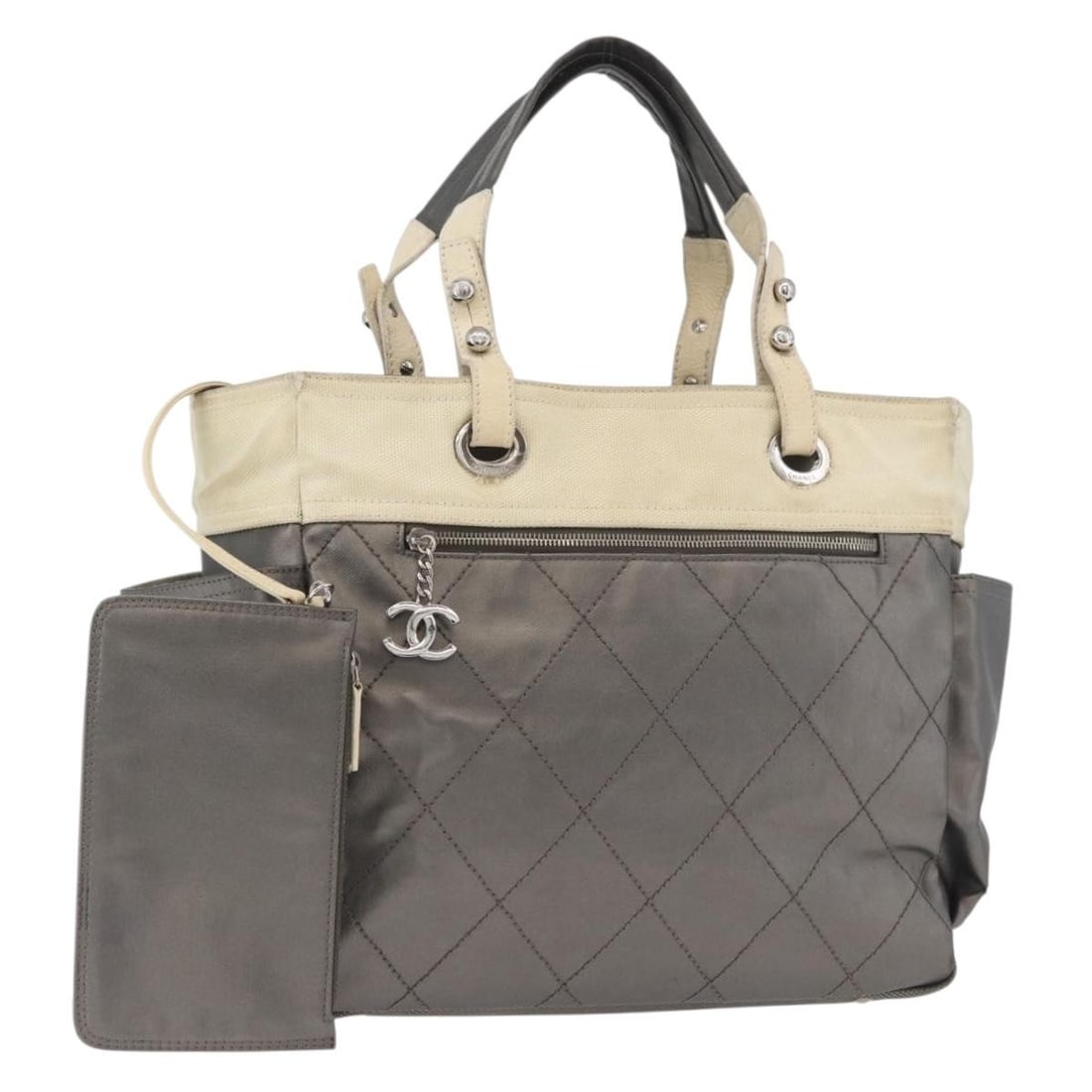 CHANEL Paris Biarritz MM Silver Coated Canvas Tote with Pouch: CHANEL Paris Biarritz MM Silver Coated Canvas Tote with Pouch Chanel Paris Biarritz MM tote bag in silver coated canvas with pouch. Made in Italy. This women's tote is a heavily used piece showing vis