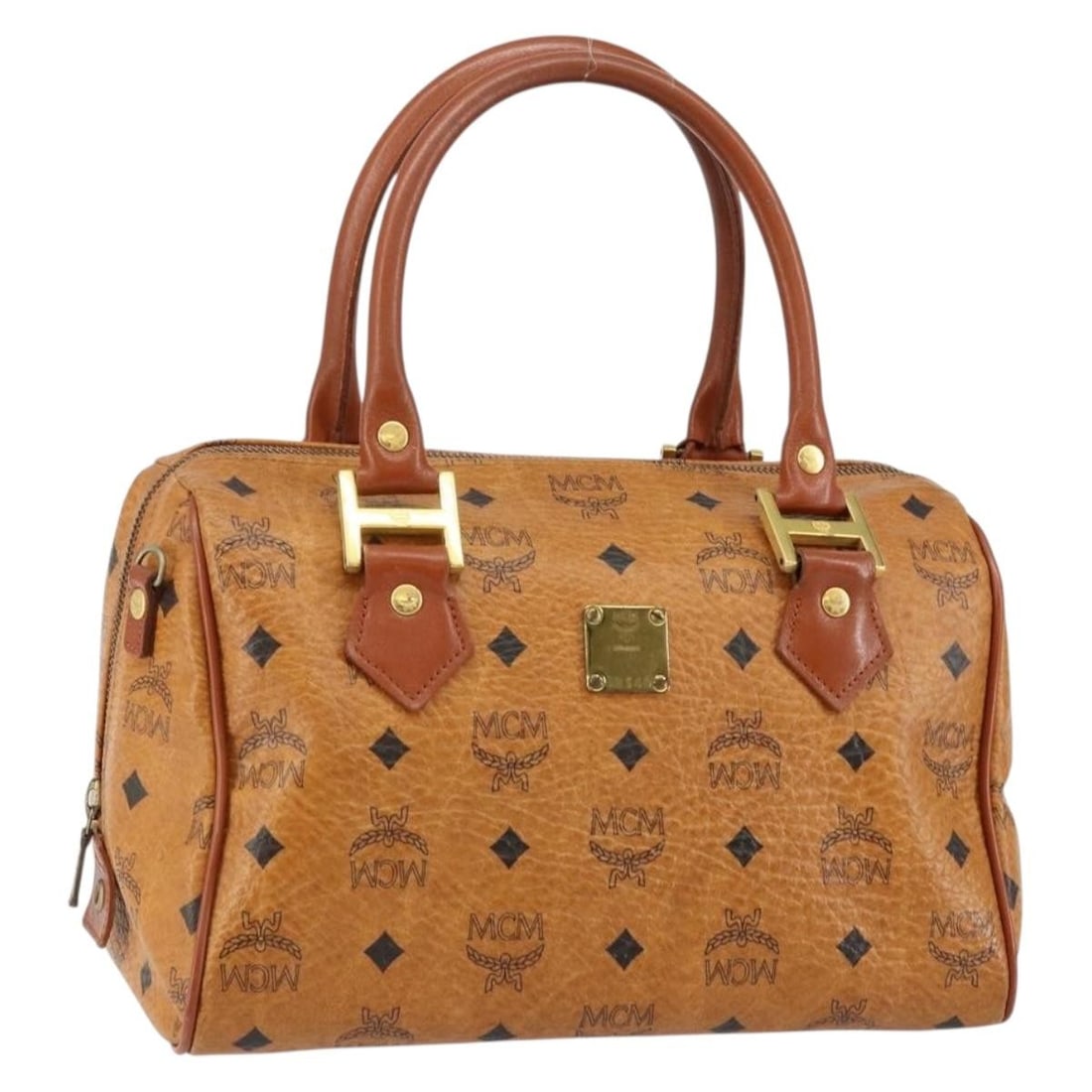 MCM Vicetos Brown Gold PVC Logo Handbag Germany Auth: MCM Vicetos Brown Gold PVC Logo Handbag Germany Auth This MCM Vicetos Logogram handbag is crafted from brown and gold PVC leather. Designed for women, it features a structured silhouette with a top ha
